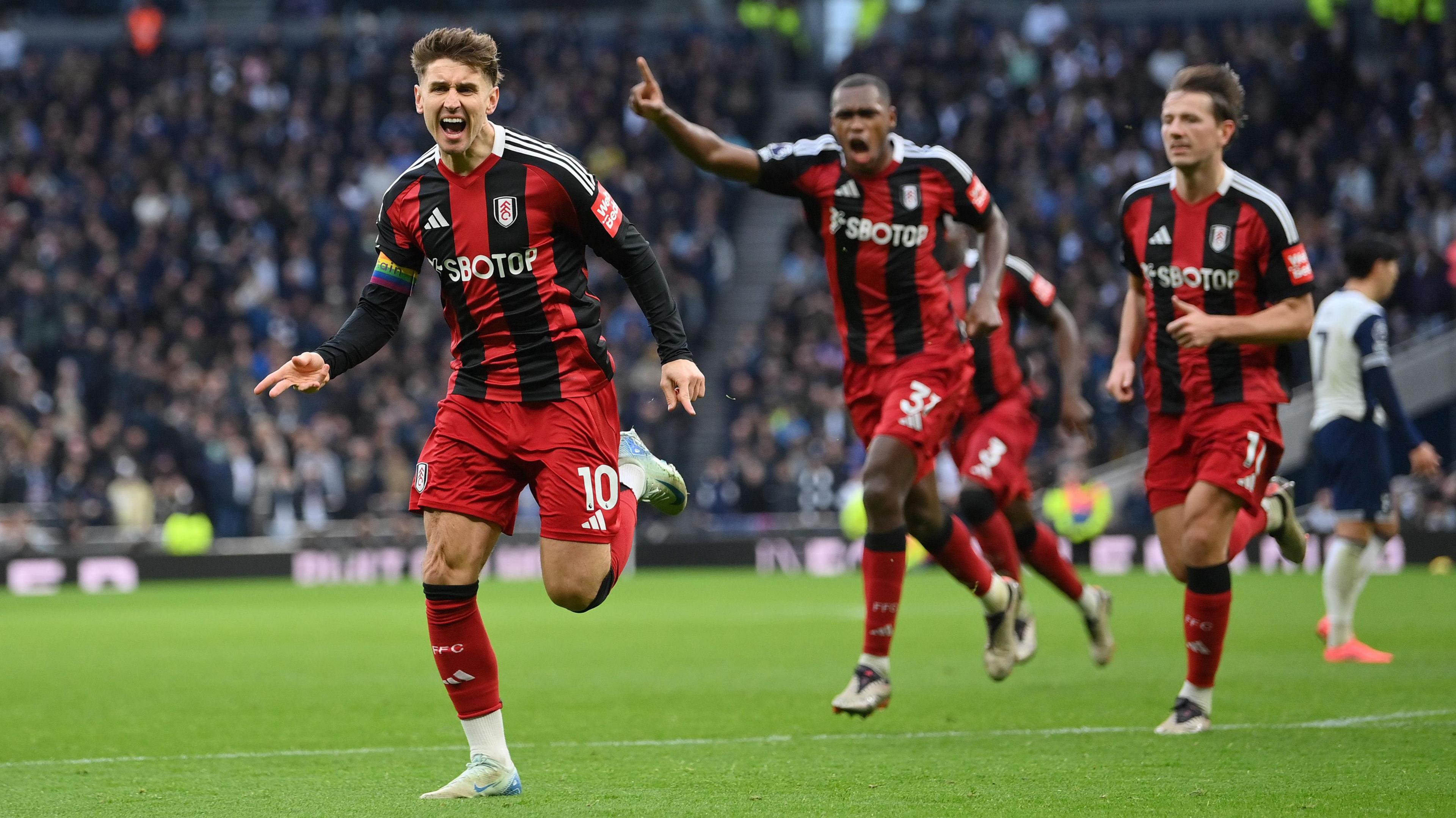 Tom Cairney of Fulham celebrates scoring his team's first goal during the Premier League match between Tottenham Hotspur FC and Fulham FC at Tottenham Hotspur Stadium