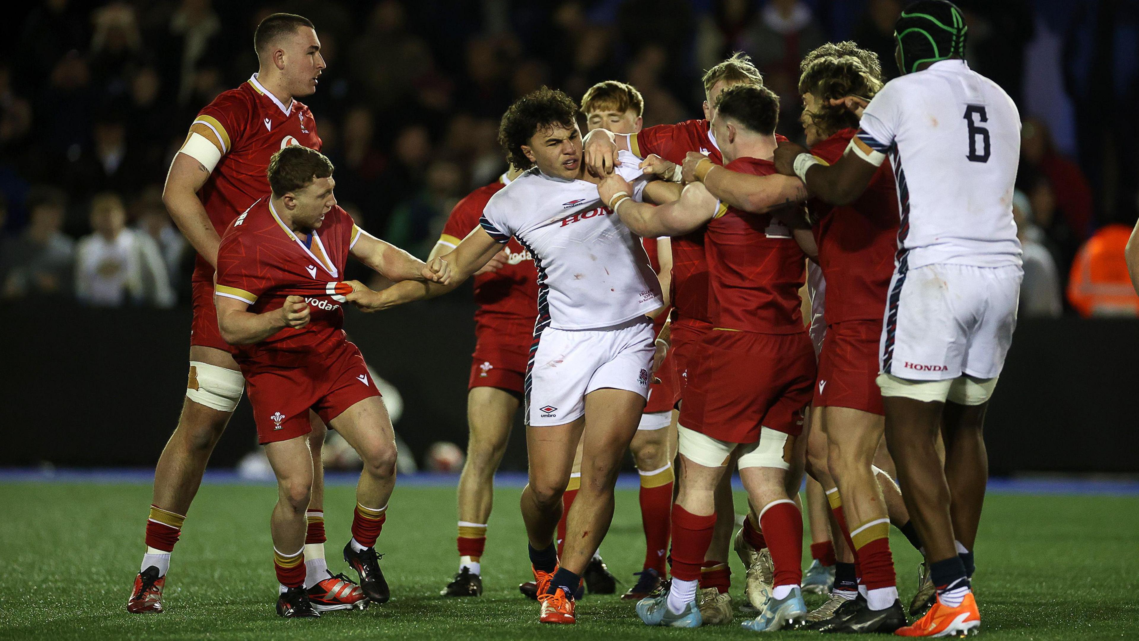 Kane James (centre) in action for England U20s against Wales