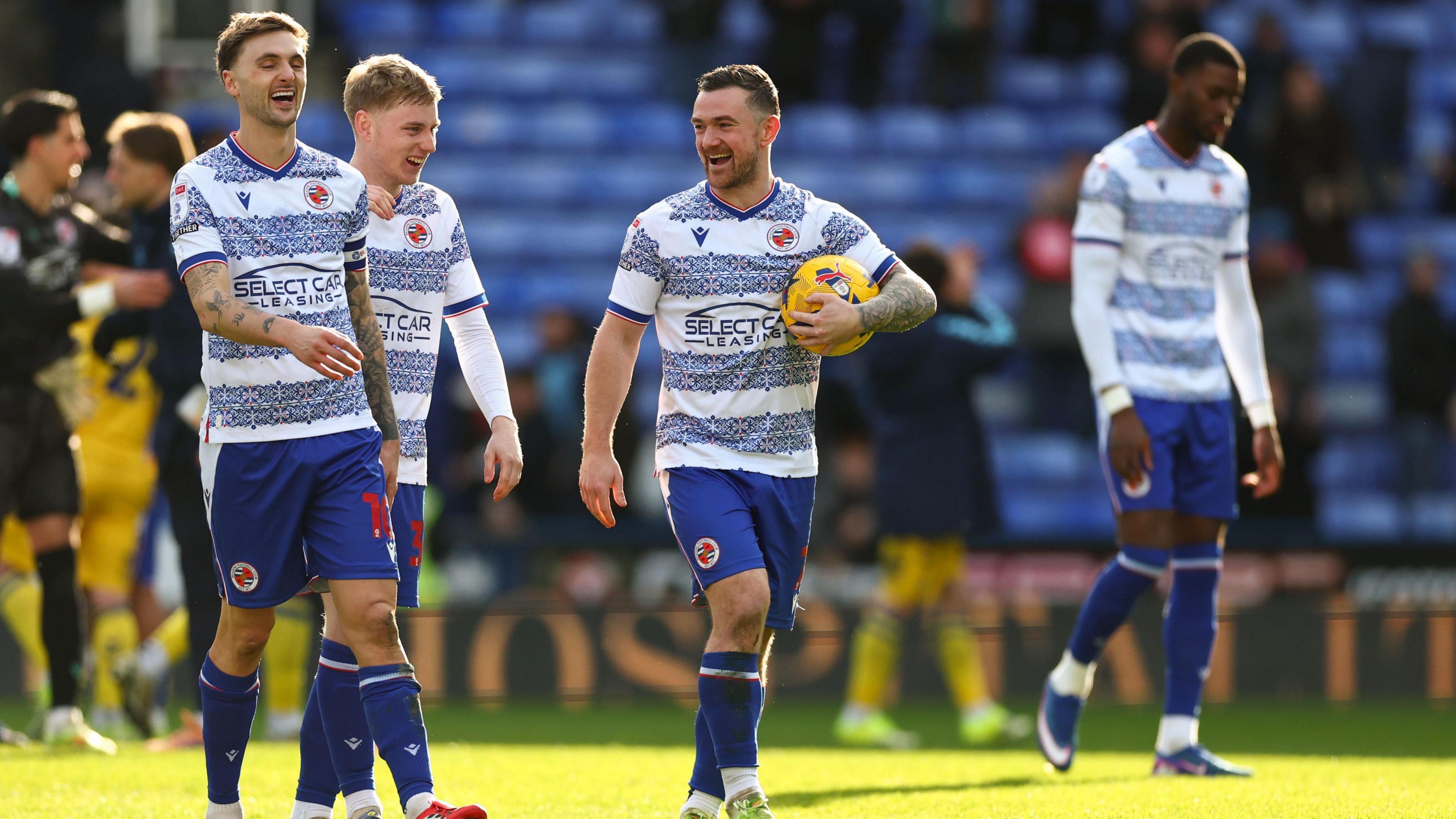 Lewis Wing, Paddy Lane and Jack Marriott celebrate after a game