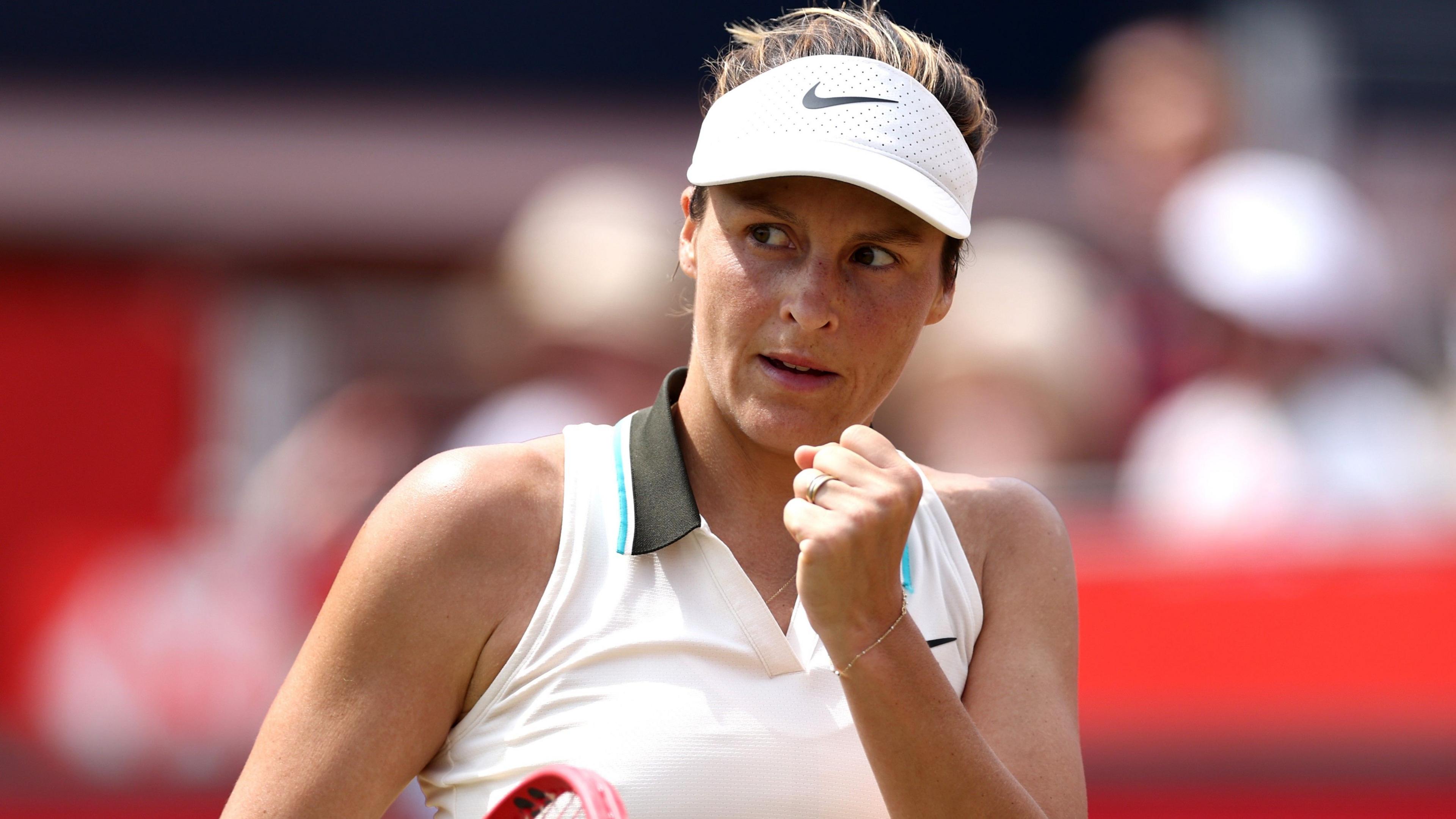 Tatjana Maria celebrates a point in the Queen's final against Amanda Anisimova