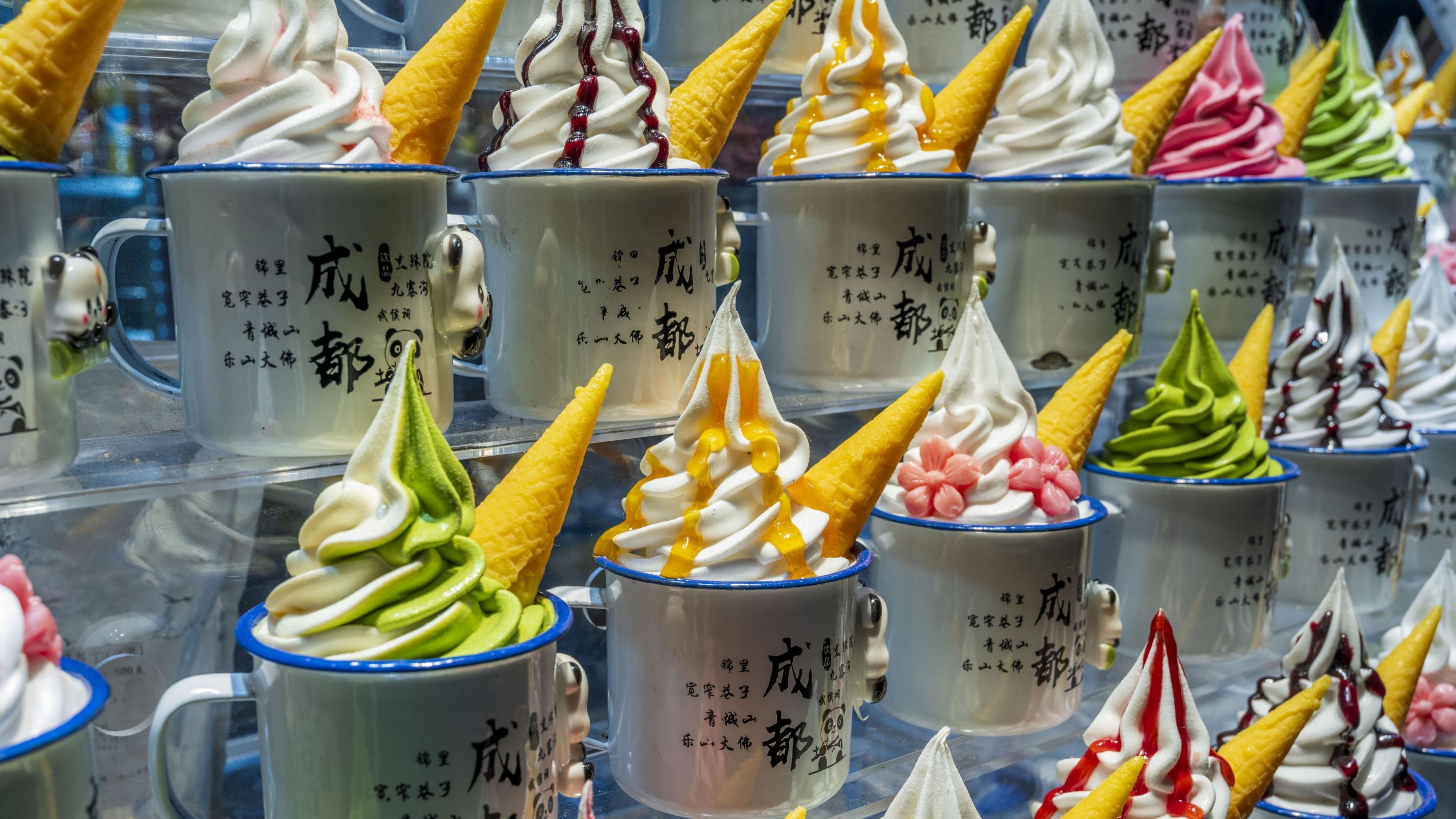 Colourful ice creams in mugs in a shop window in Chengdu, China.