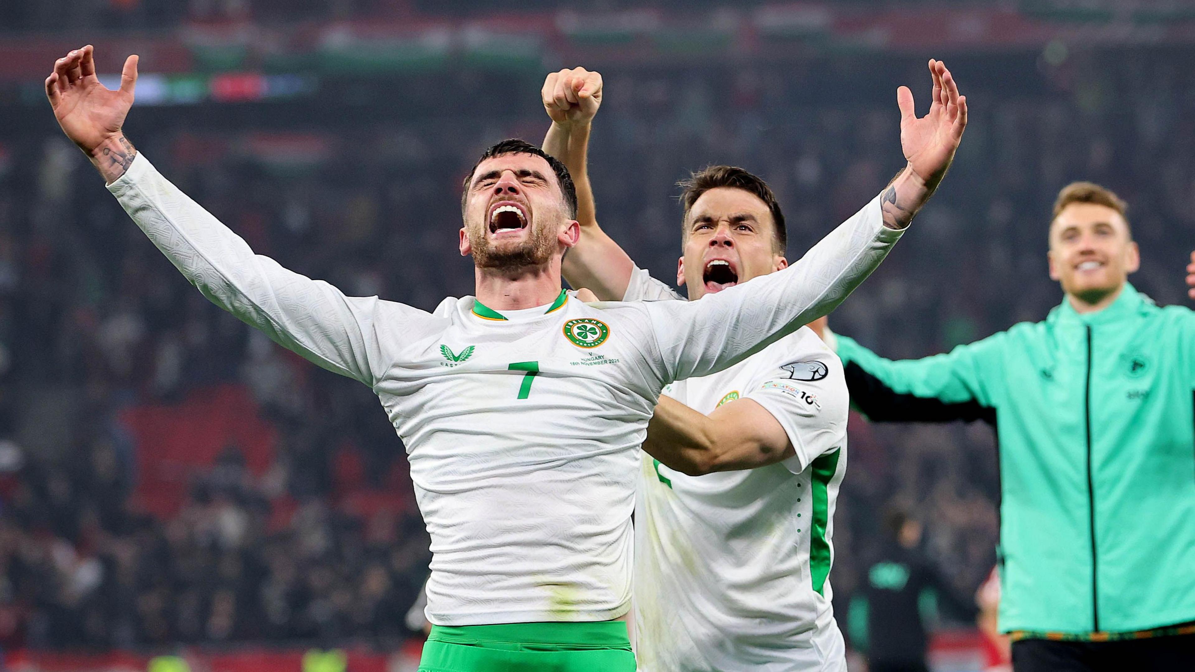 Troy Parrott and Seamus Coleman celebrate
