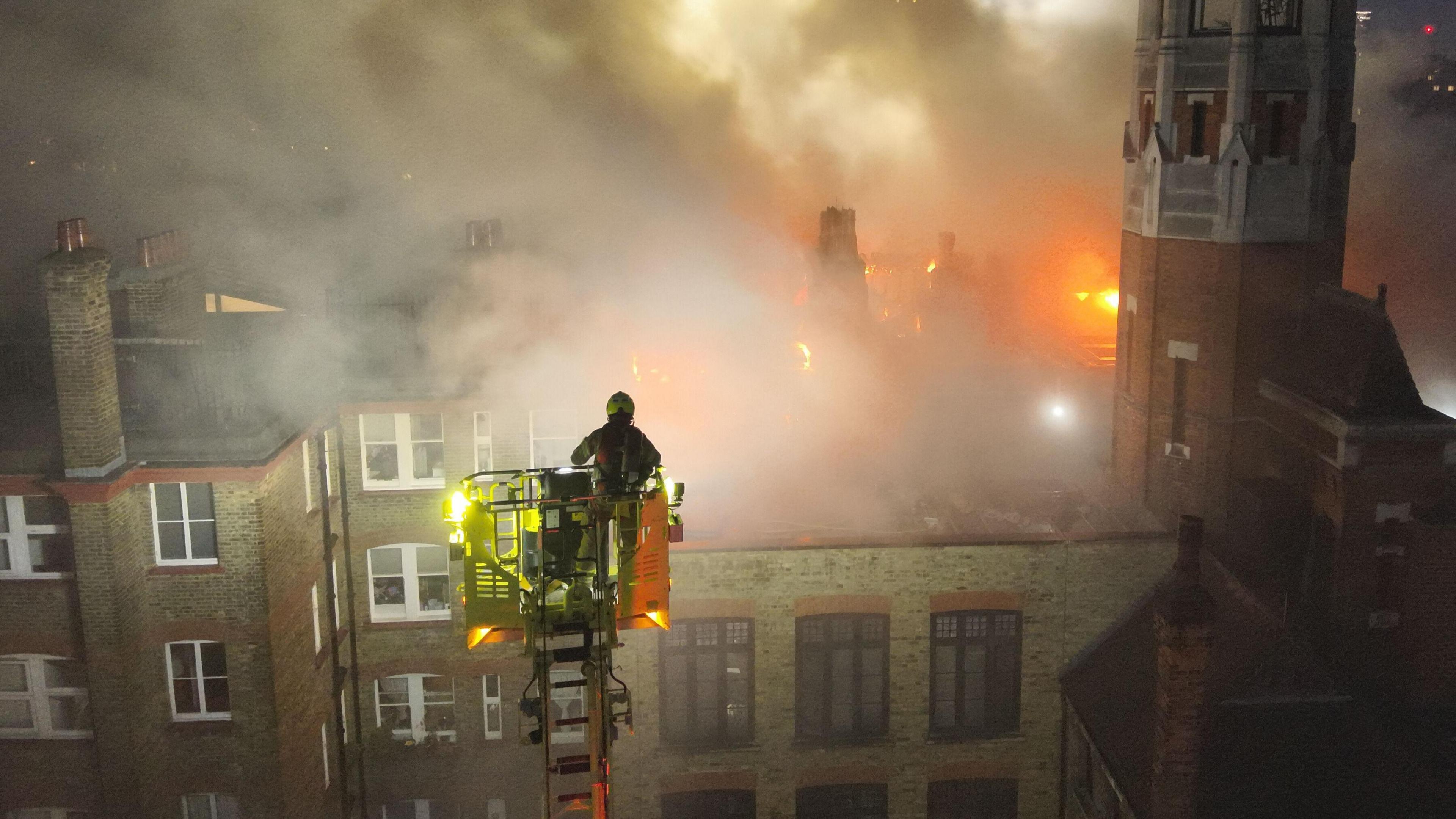 The Chiltern Firehouse aerial drone shot - fire and smoke can be seen pouring from the roof.