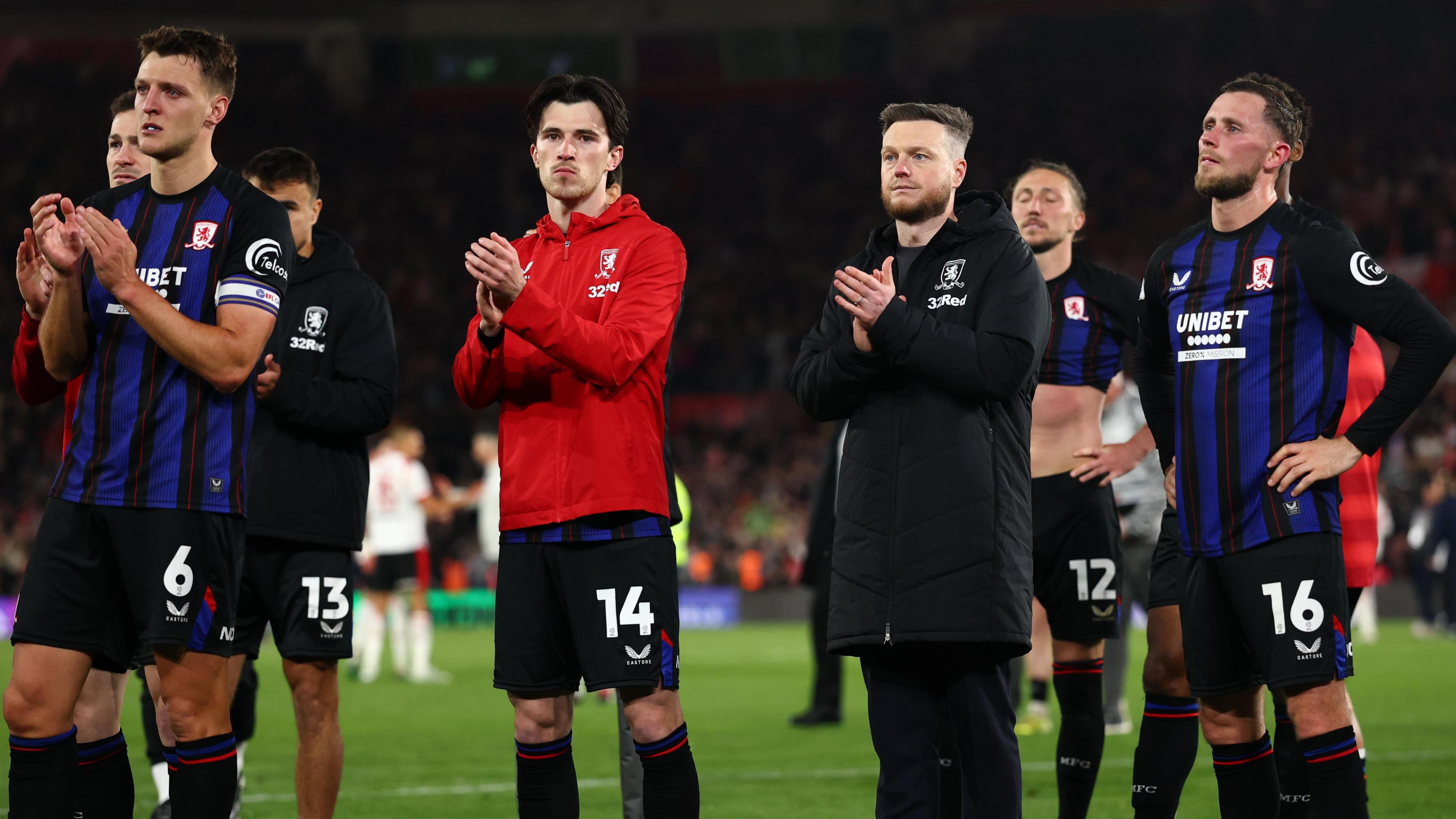 Kim Hellberg manager of Middlesbrough applauds fans at full time alongside Middlesbrough players