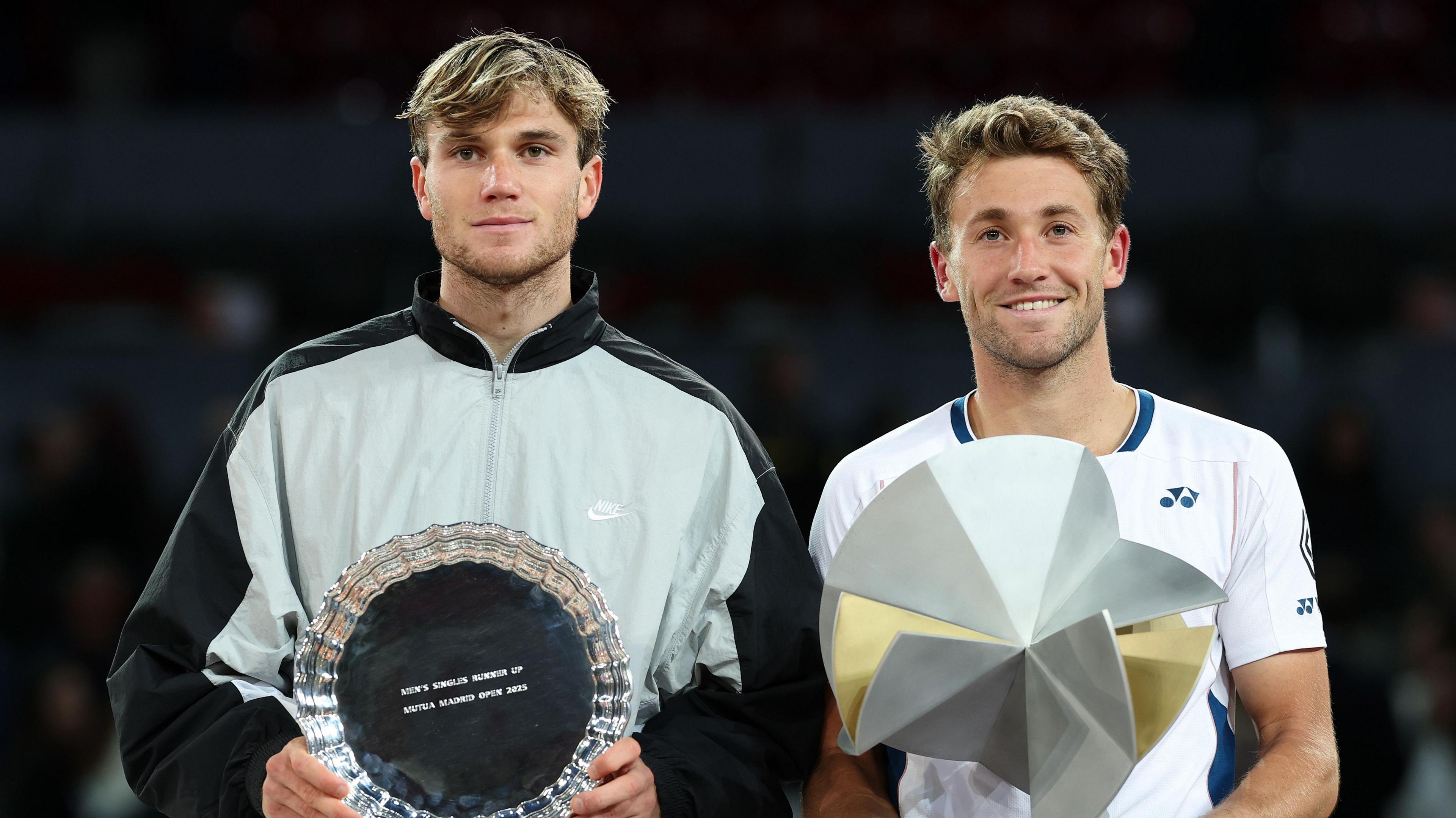 Jack Draper and Casper Ruud pose with their Madrid Open trophies