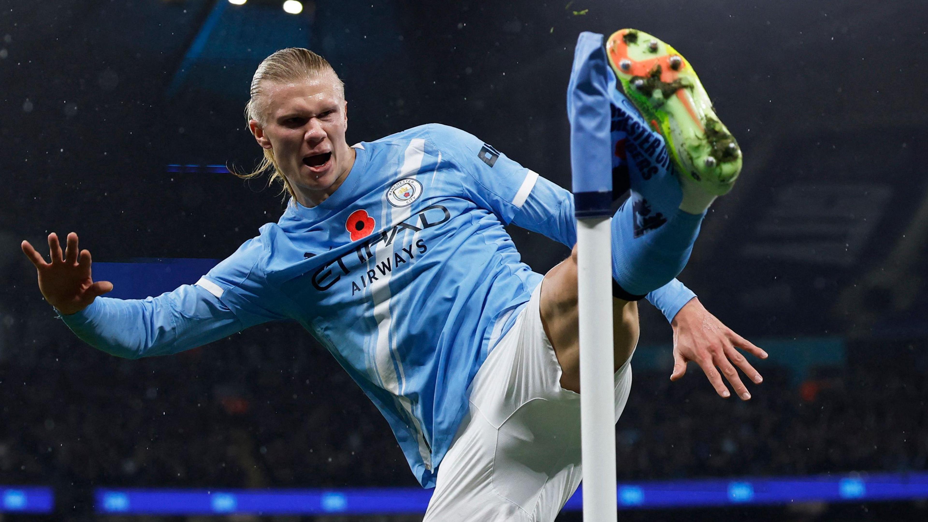 Erling Haaland kicks out in celebration after putting Manchester City ahead against Liverpool at Etihad Stadium