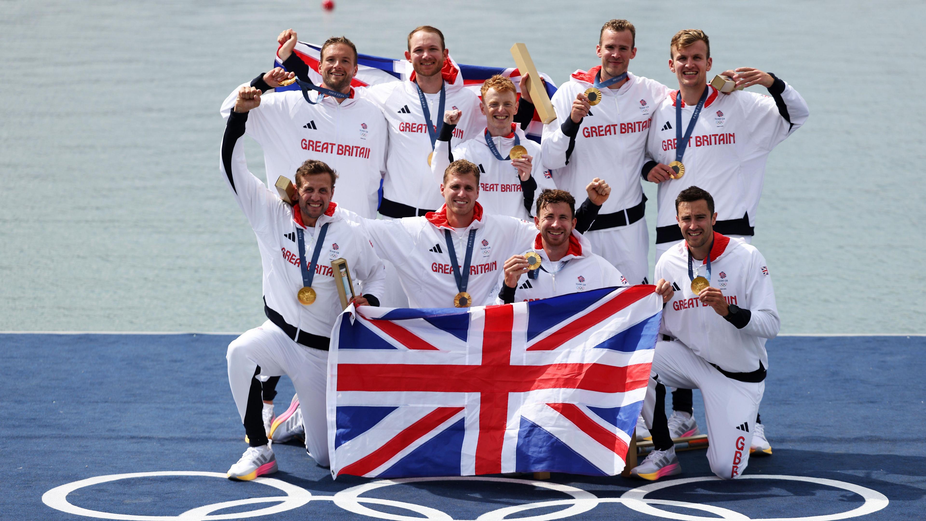 Harry Brightmore (centre) celebrates his gold medal alongside Team GB's men's eights