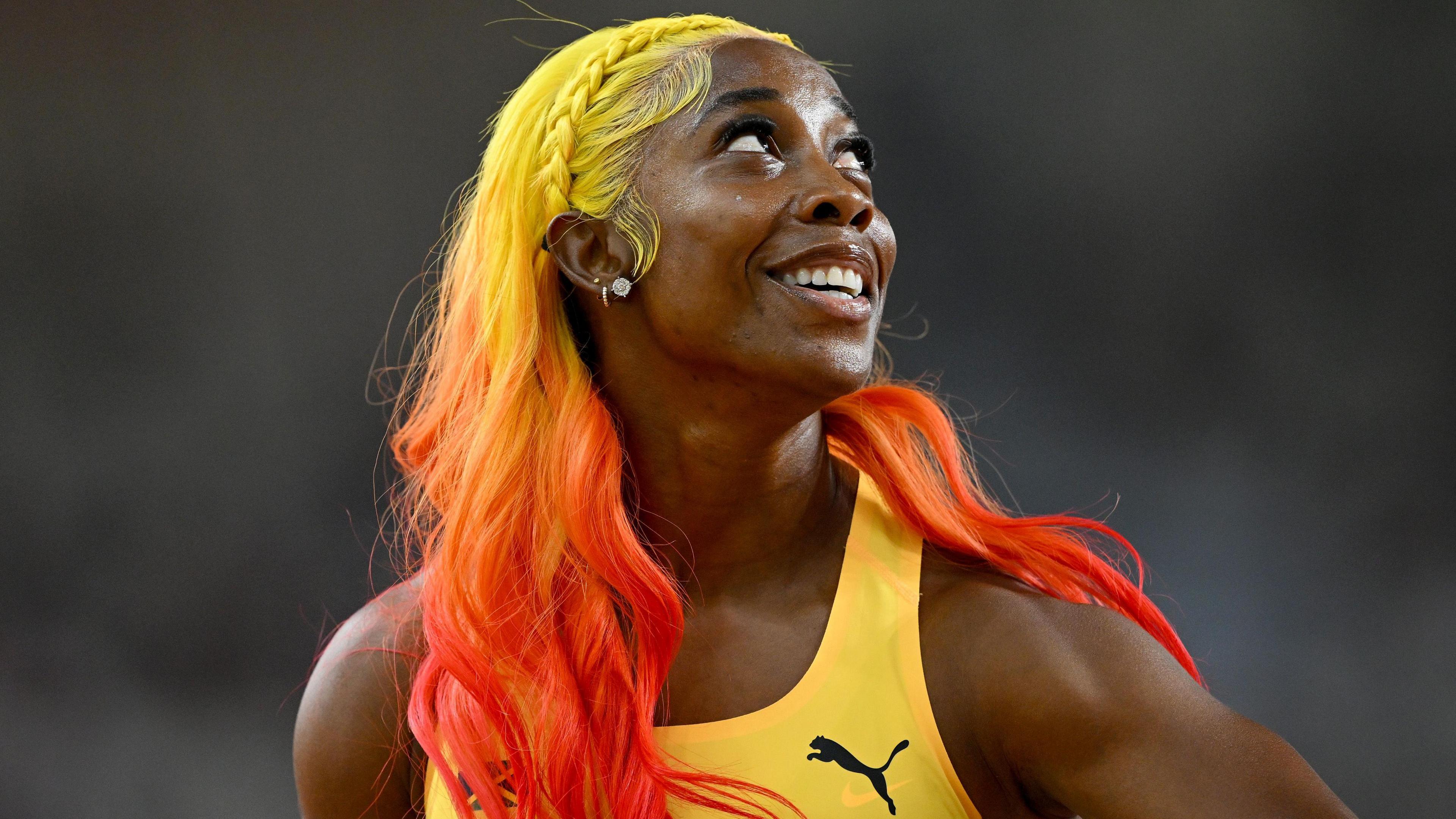 Shelly-Ann Fraser-Pryce smiling to the right of the shot 