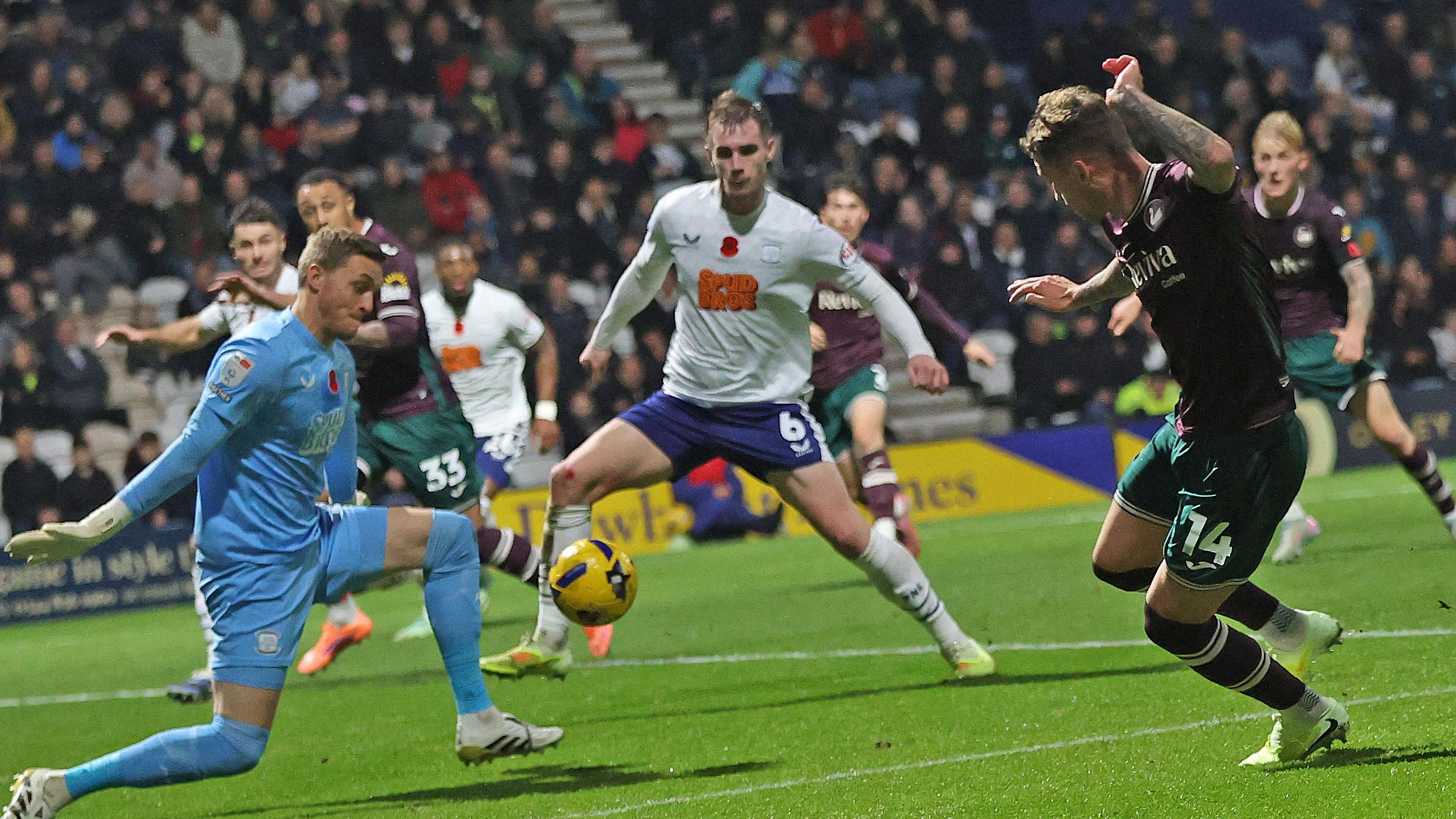 Josh Tymon's cross shot is saved by Daniel Iversen 