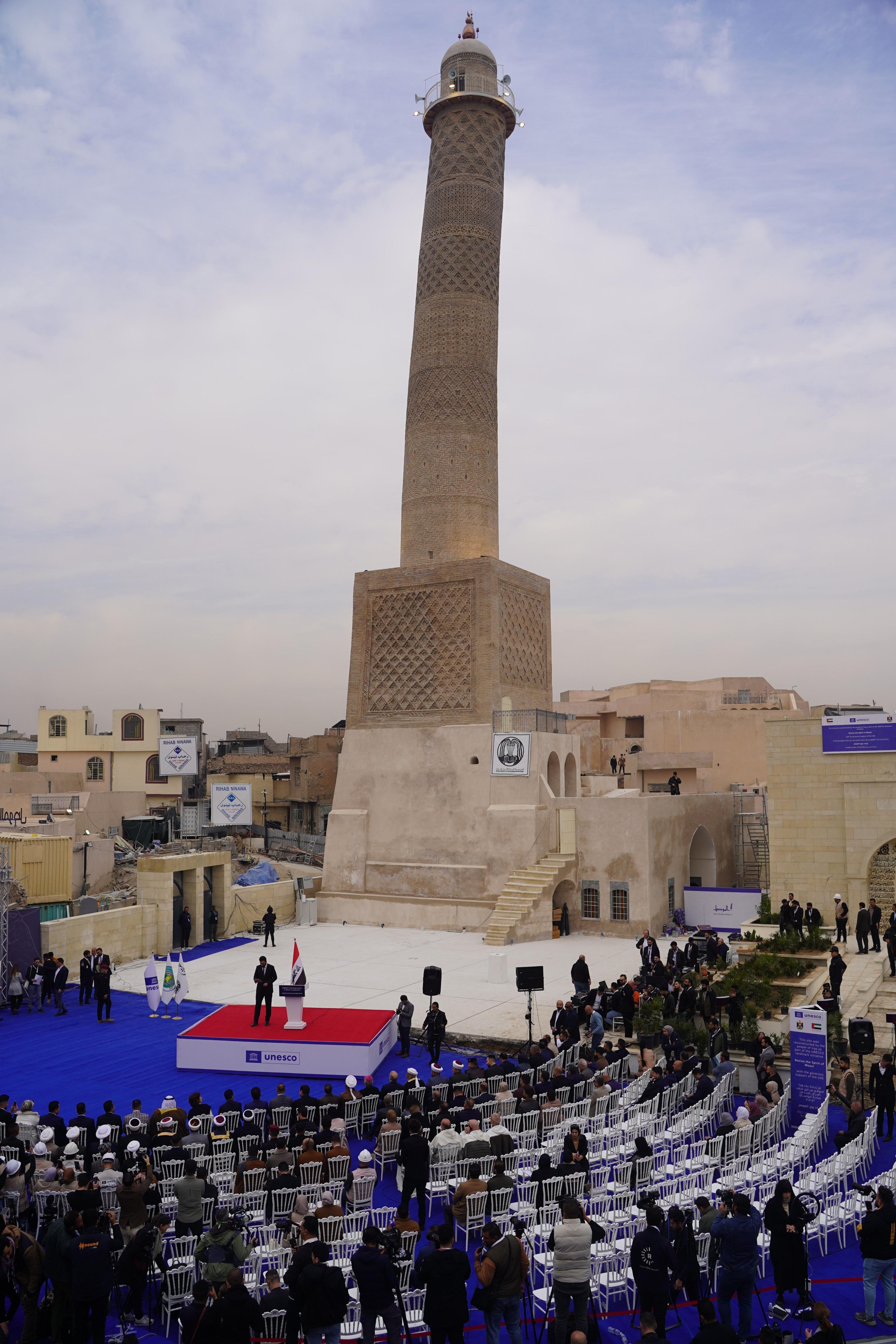 A ceremony beneath the Hadba minaret to mark the reconstruction