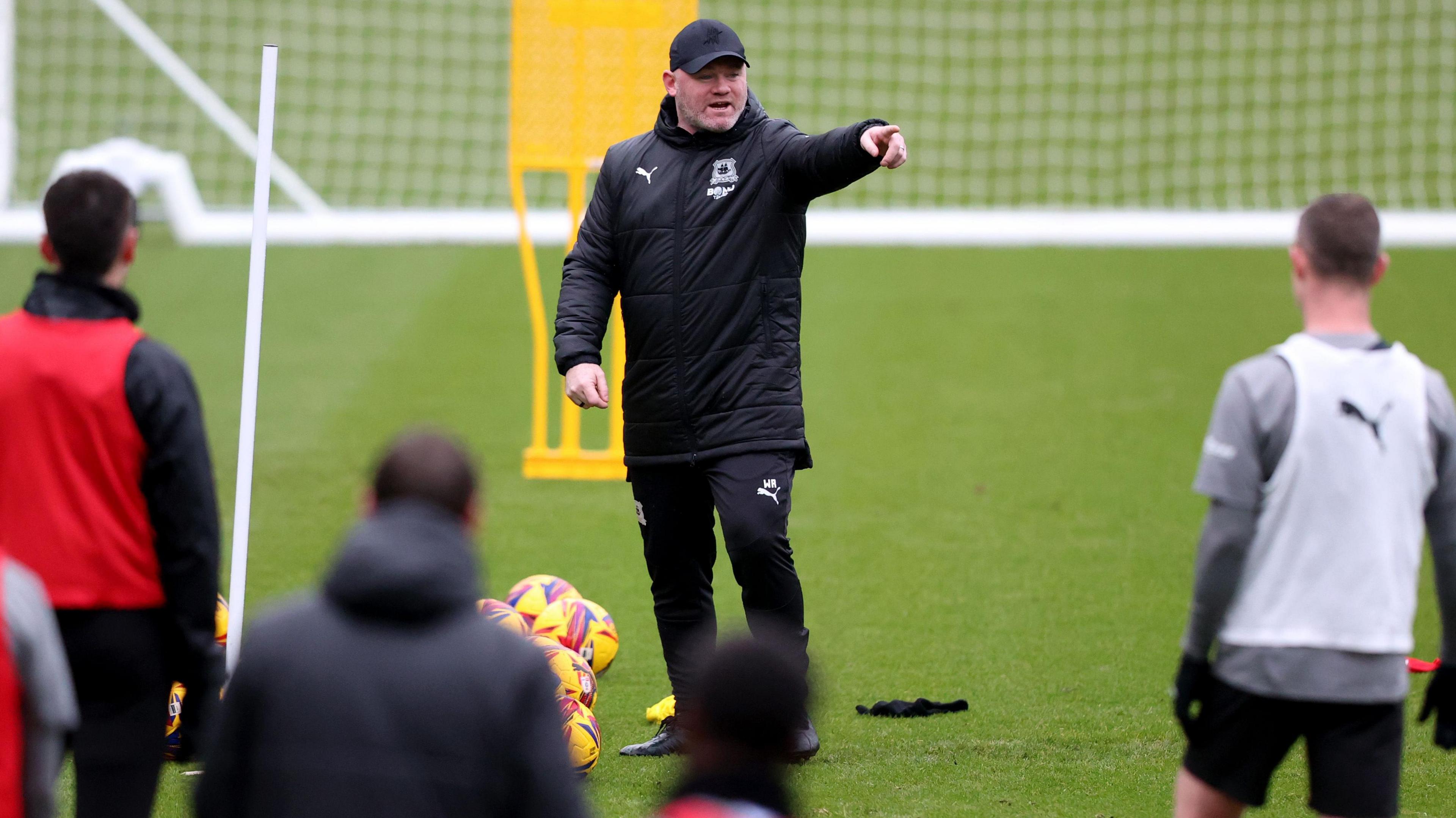 Wayne Rooney takes a training session