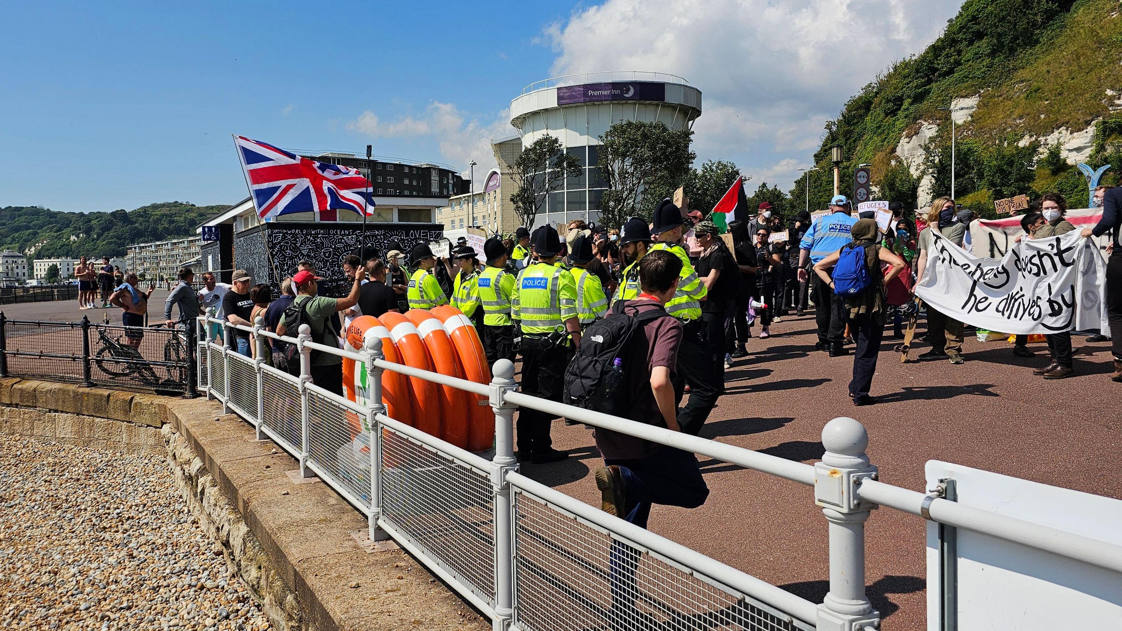 A group of anti-immigration protesters and police