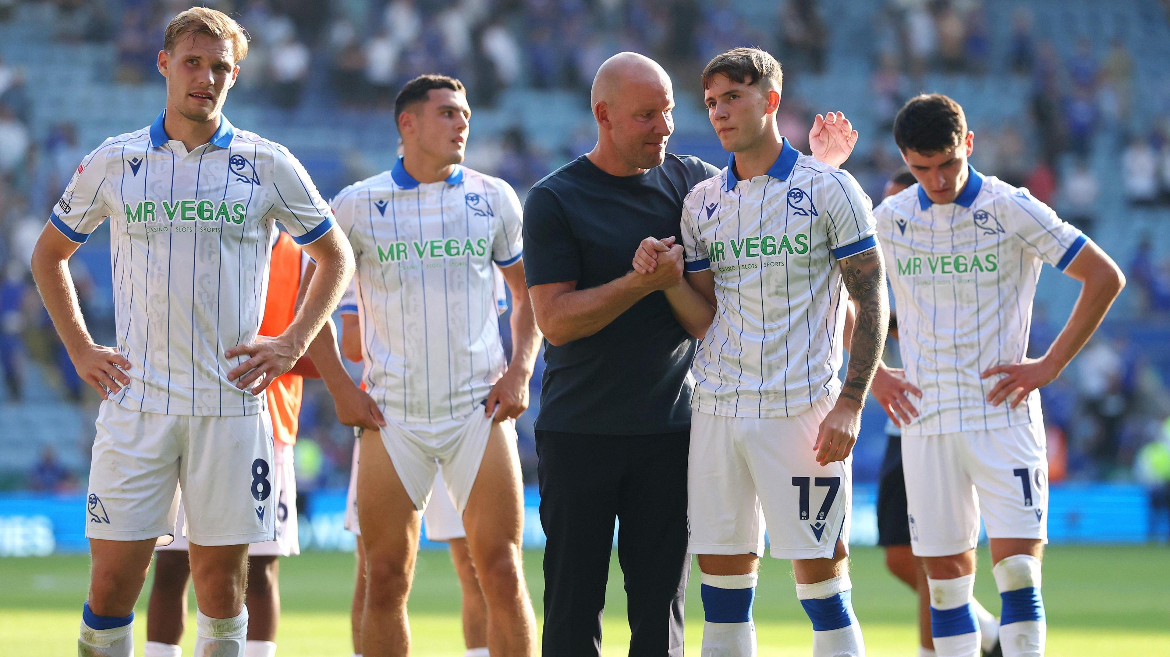 Sheffield Wednesday's players and manager look disappointed after defeat