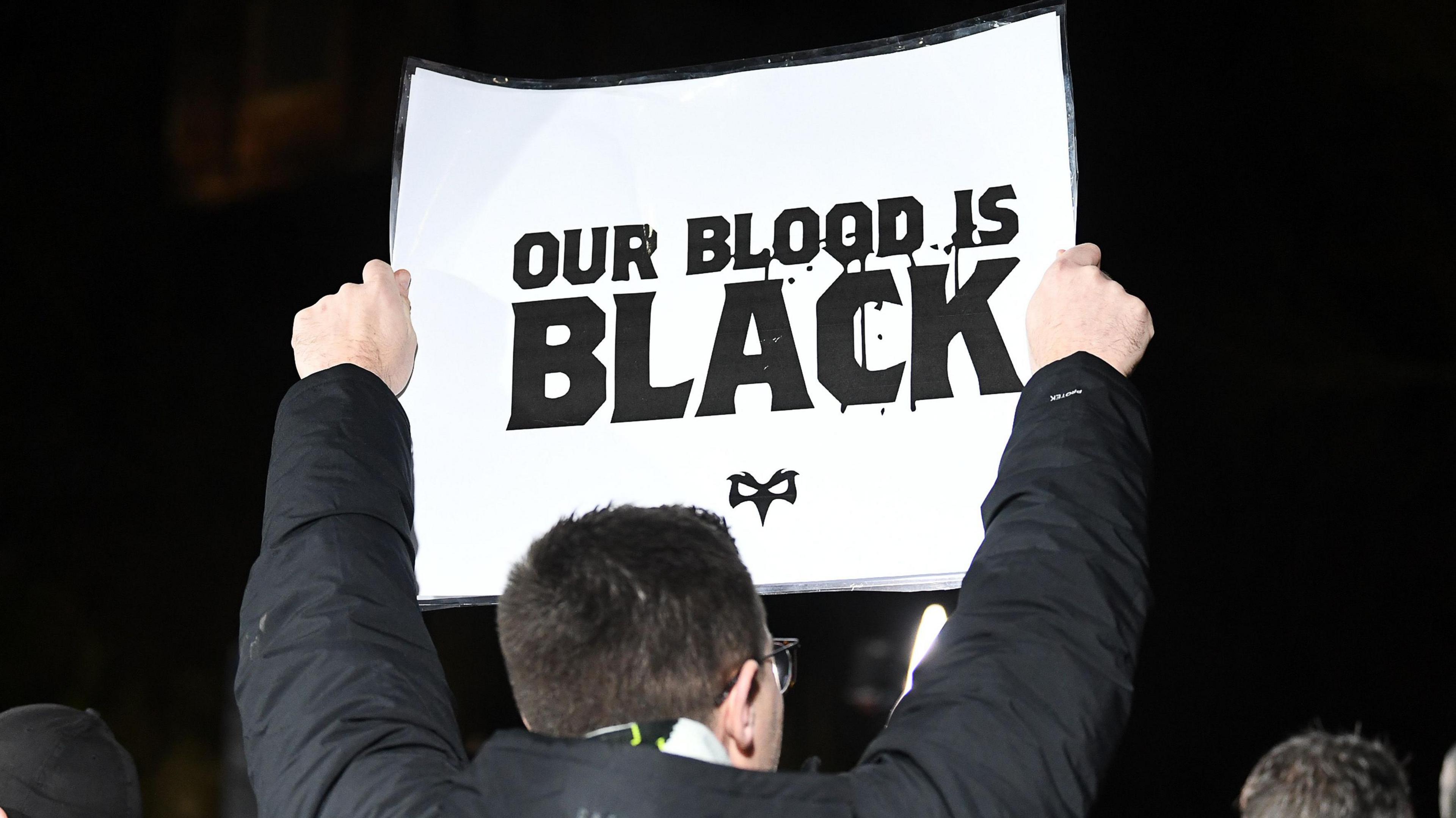 An Ospreys fan demonstrating after the news that Y11 was in talks to buy Cardiff