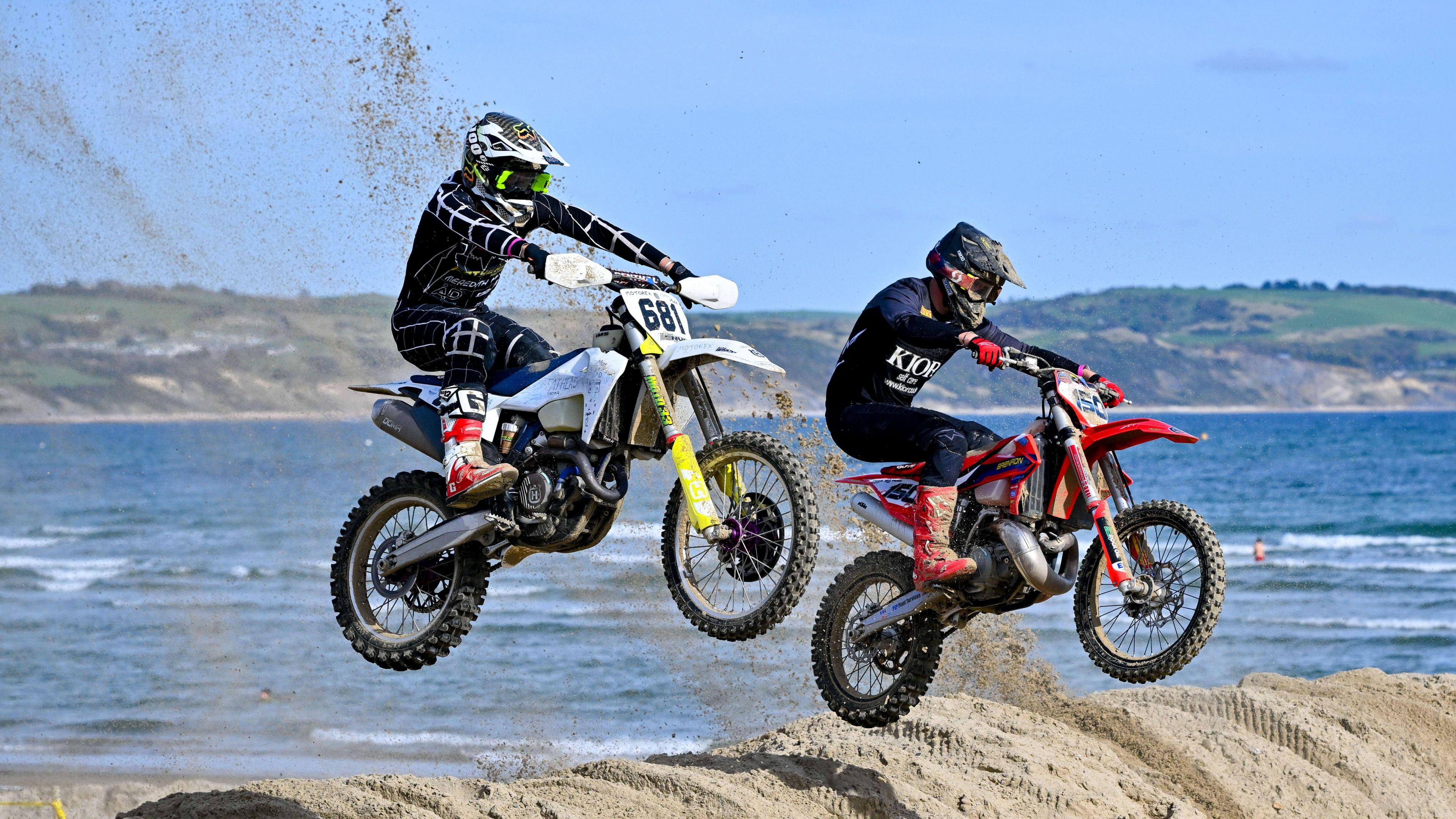 Bikers jumping on the beach