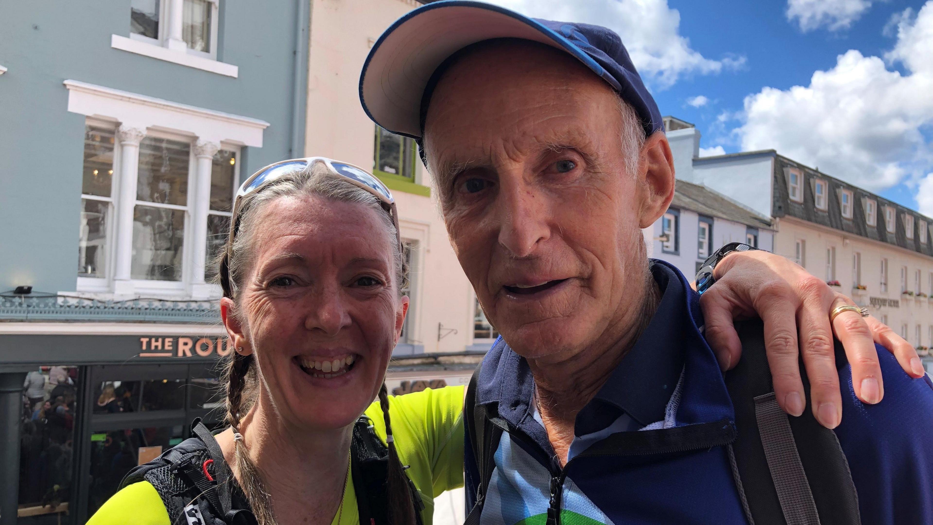 Ella Scott, who has braided light brown hair, with Joss Naylor, who is wearing a cap and a fleece.