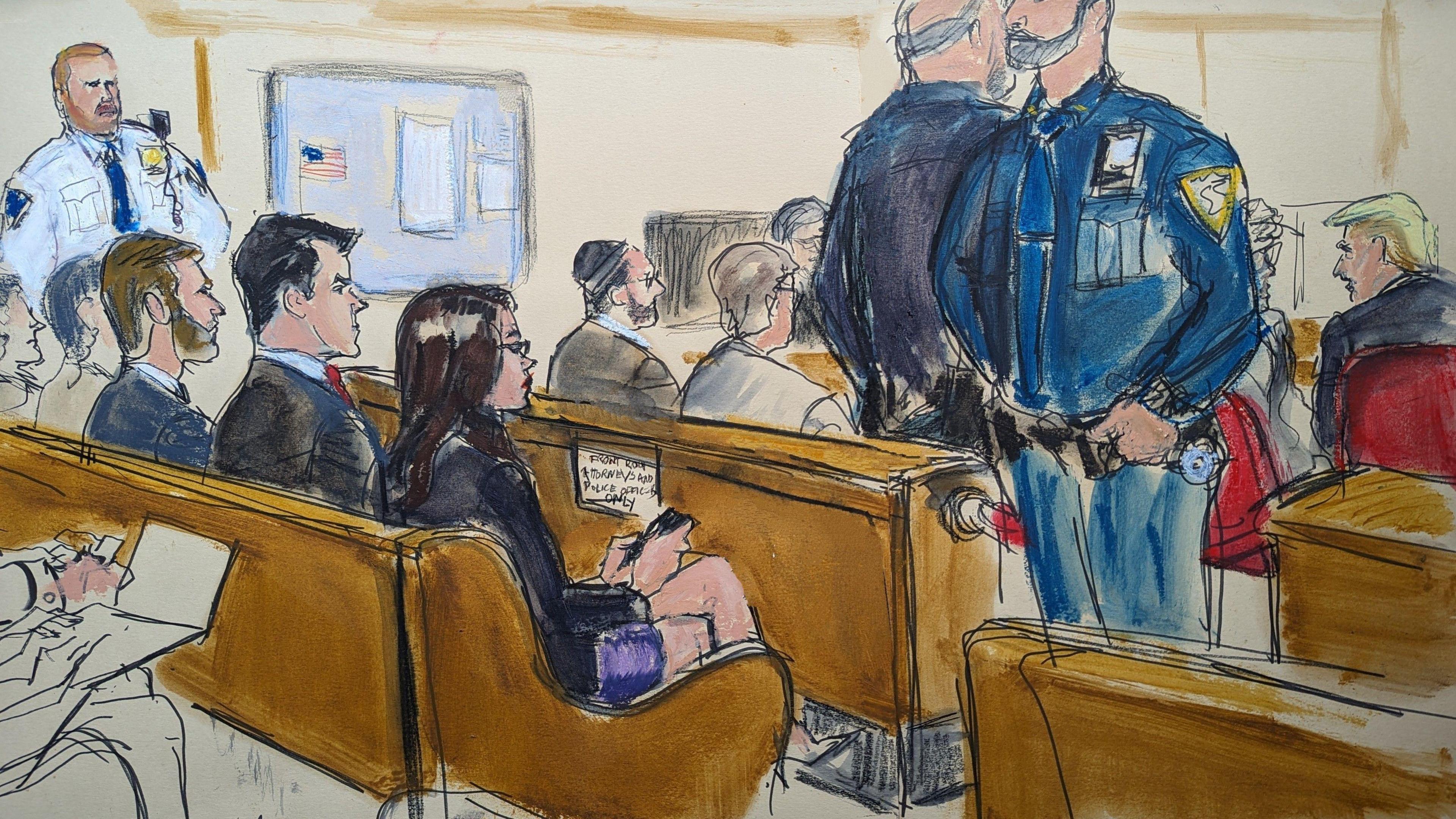 Sketch of inside courtroom, includes guards standing and Republican lawmakers Lauren Boebert and Matt Gaetz, Eric Trump and Donald Trump seated