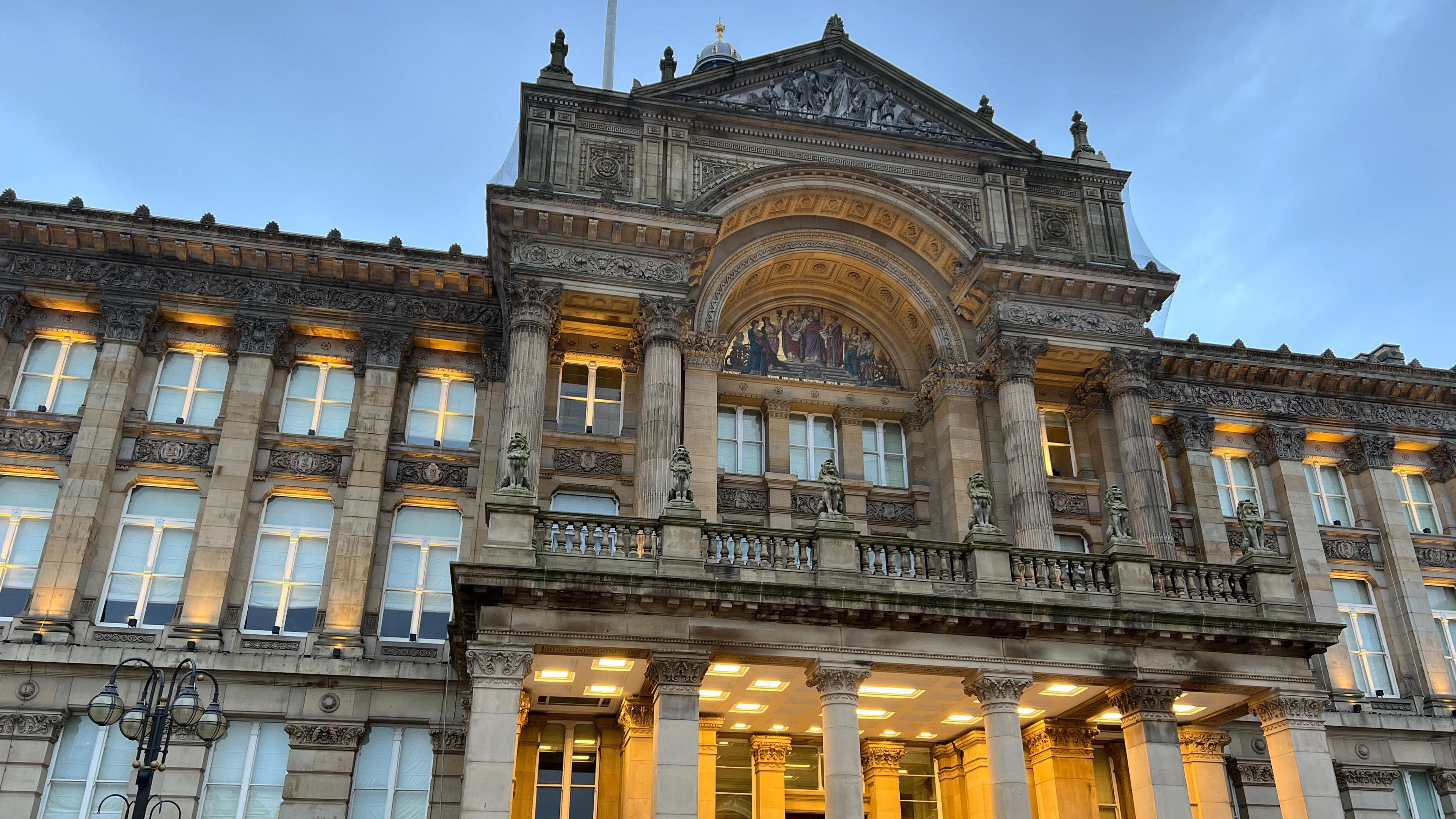 Birmingham council house, lit up in a dusk sky 