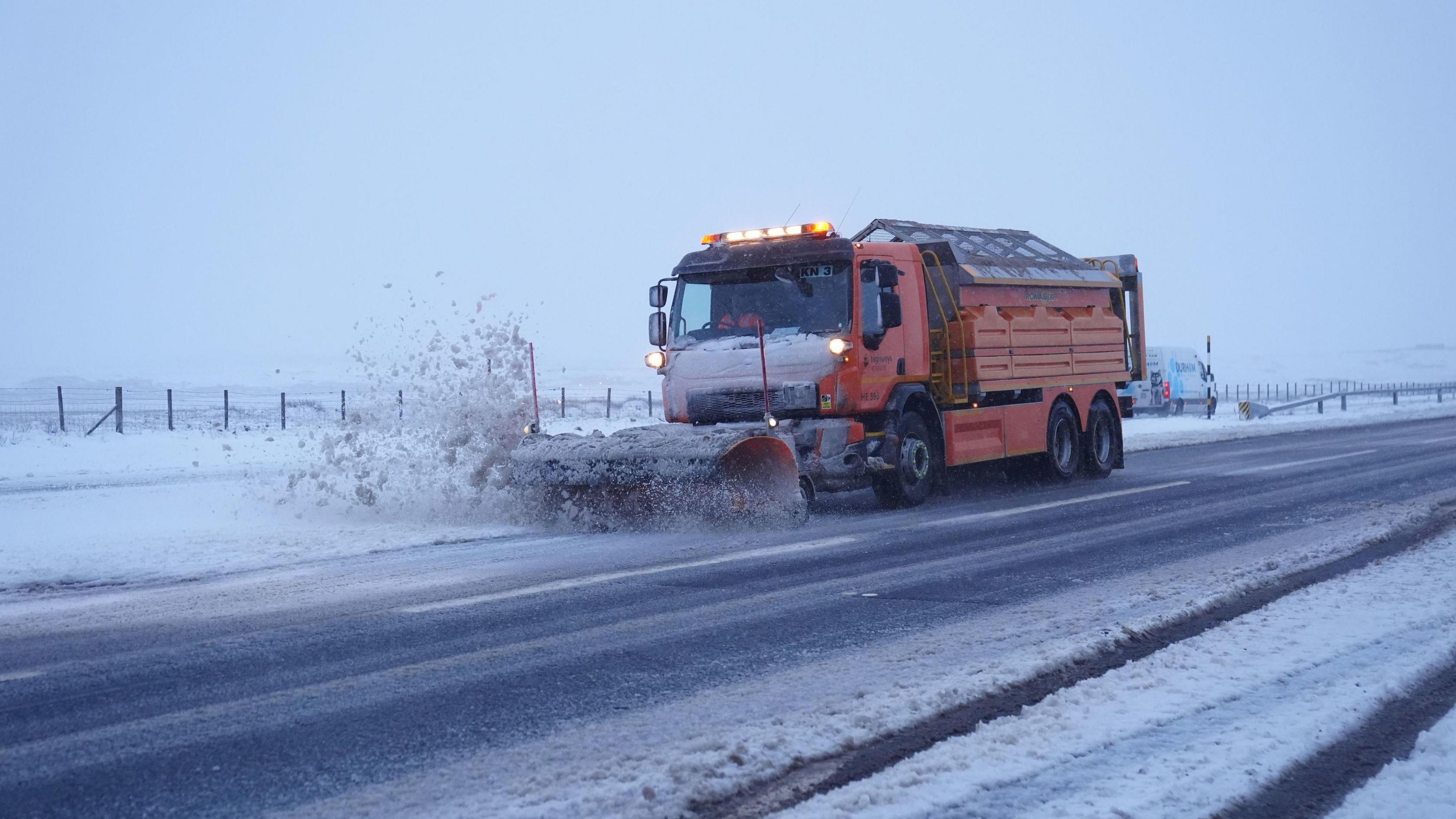 a snow clearing truck on the road in County Durham.