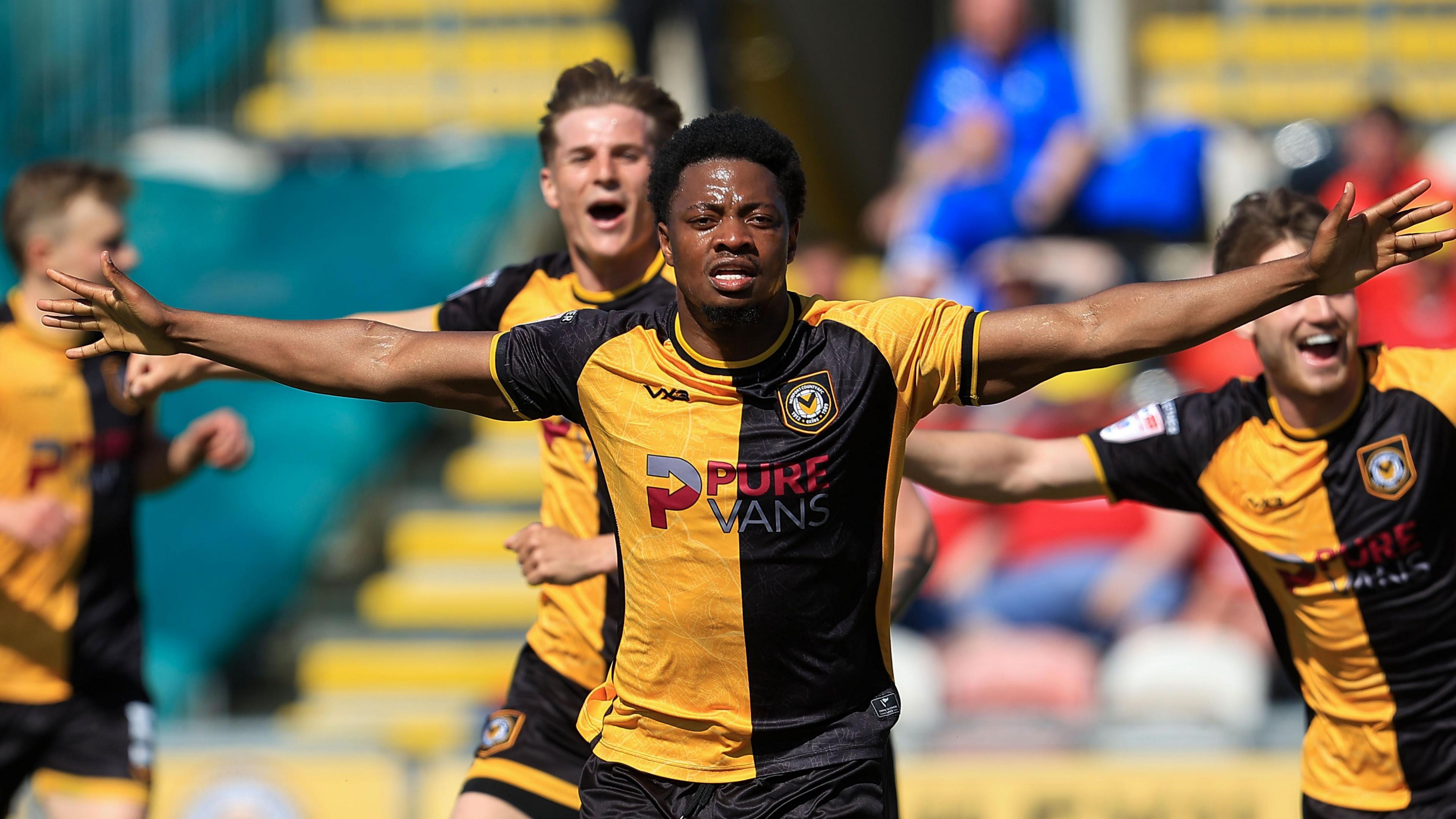 Bobby Kamwa celebrates scoring for Newport County