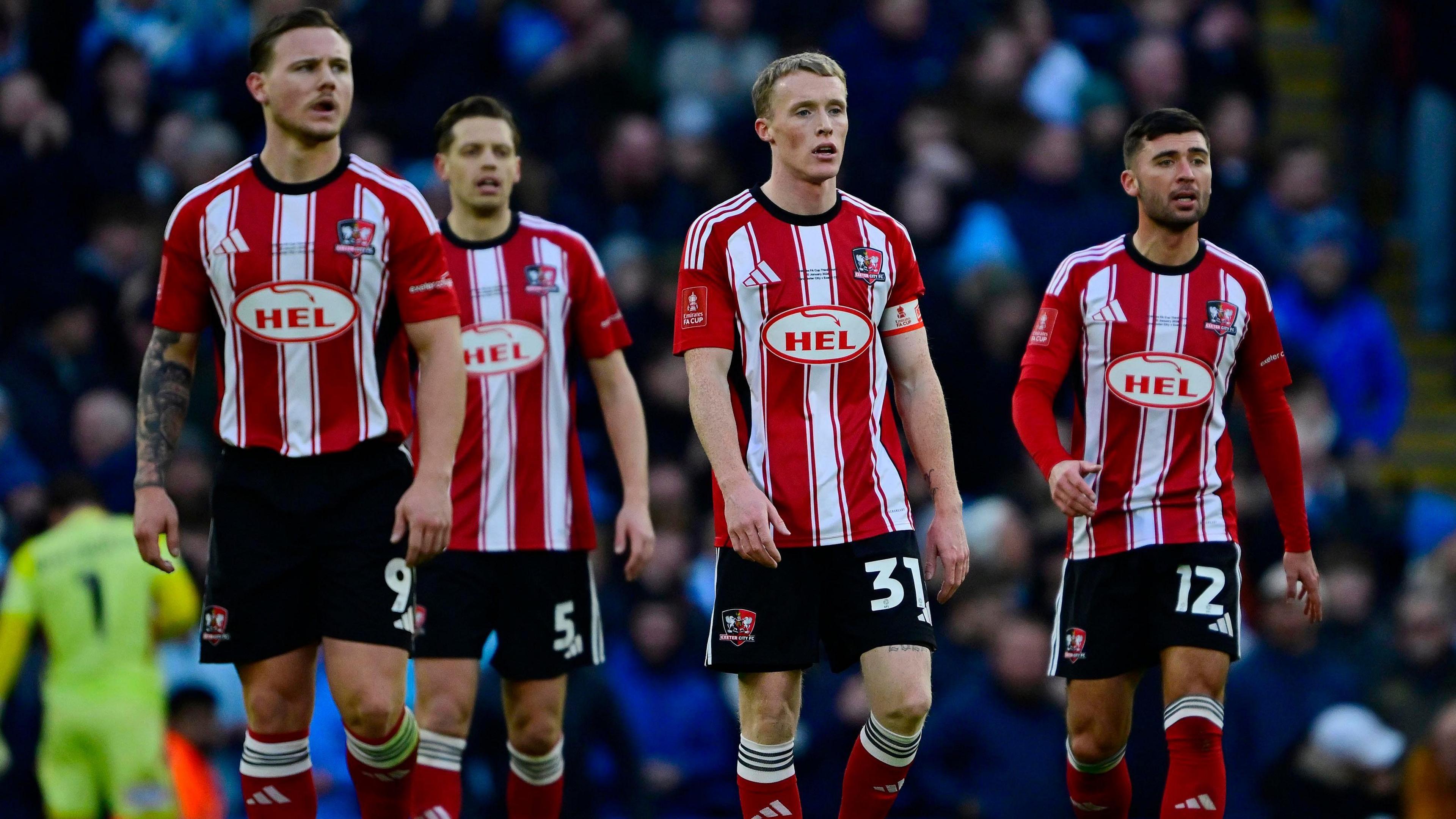 Exeter City players look forlorn after conceding a goal