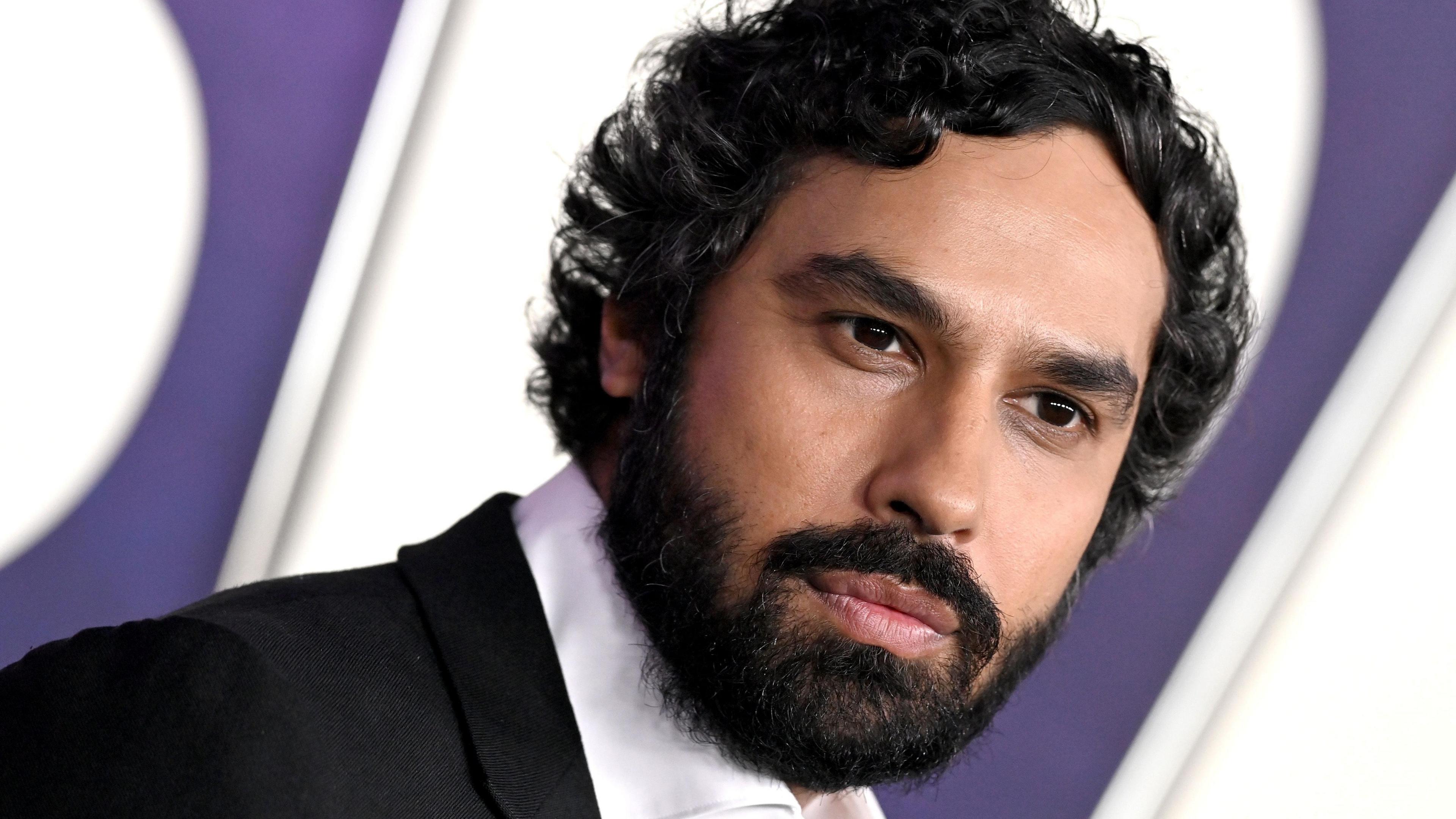 Kunal Nayyar, an Indian man in his 40s, with a beard and curly hair