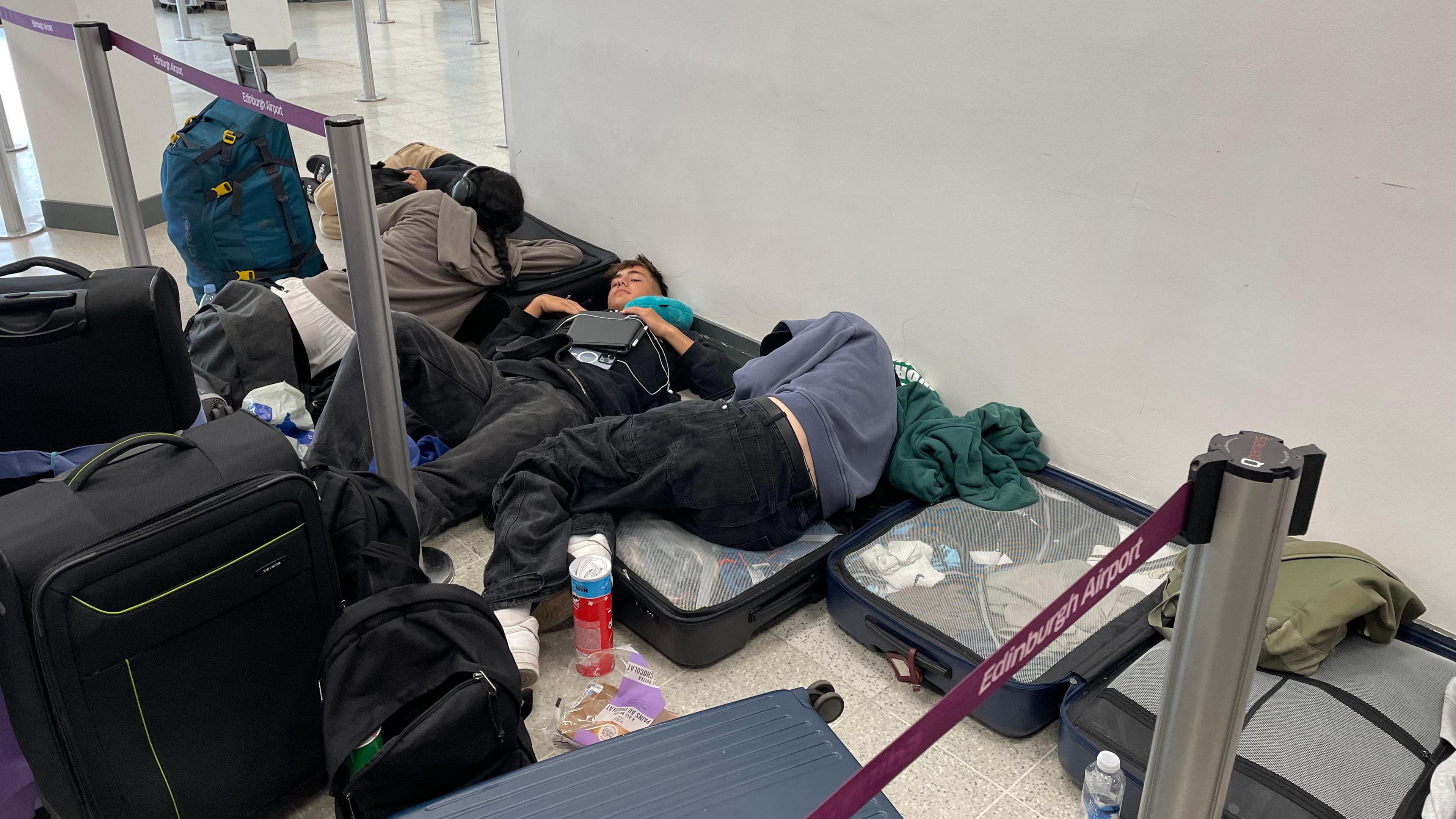 Passengers sleeping on the floor of Edinburgh Airport