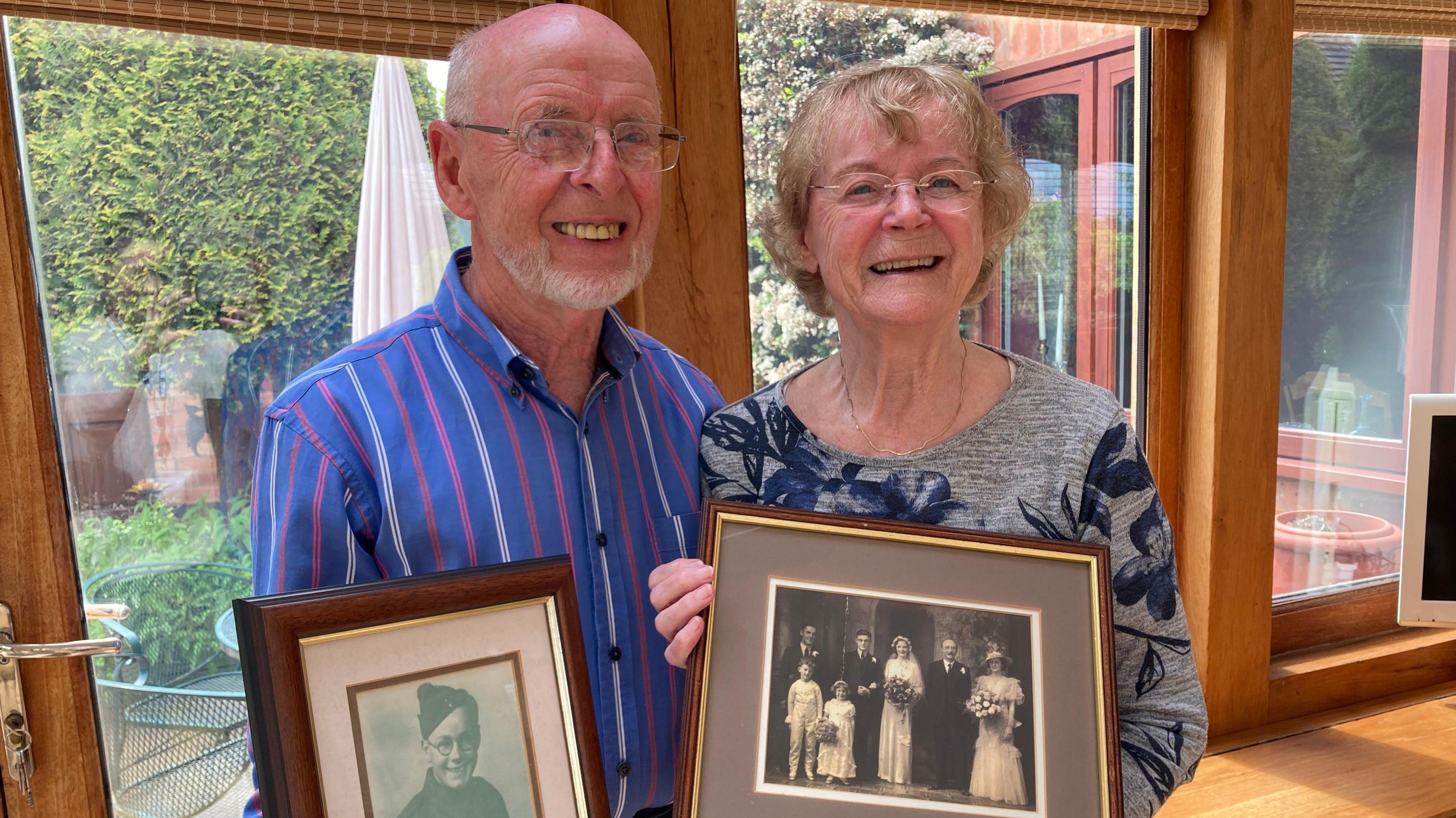 Diana Talbot holding pictures of her dad