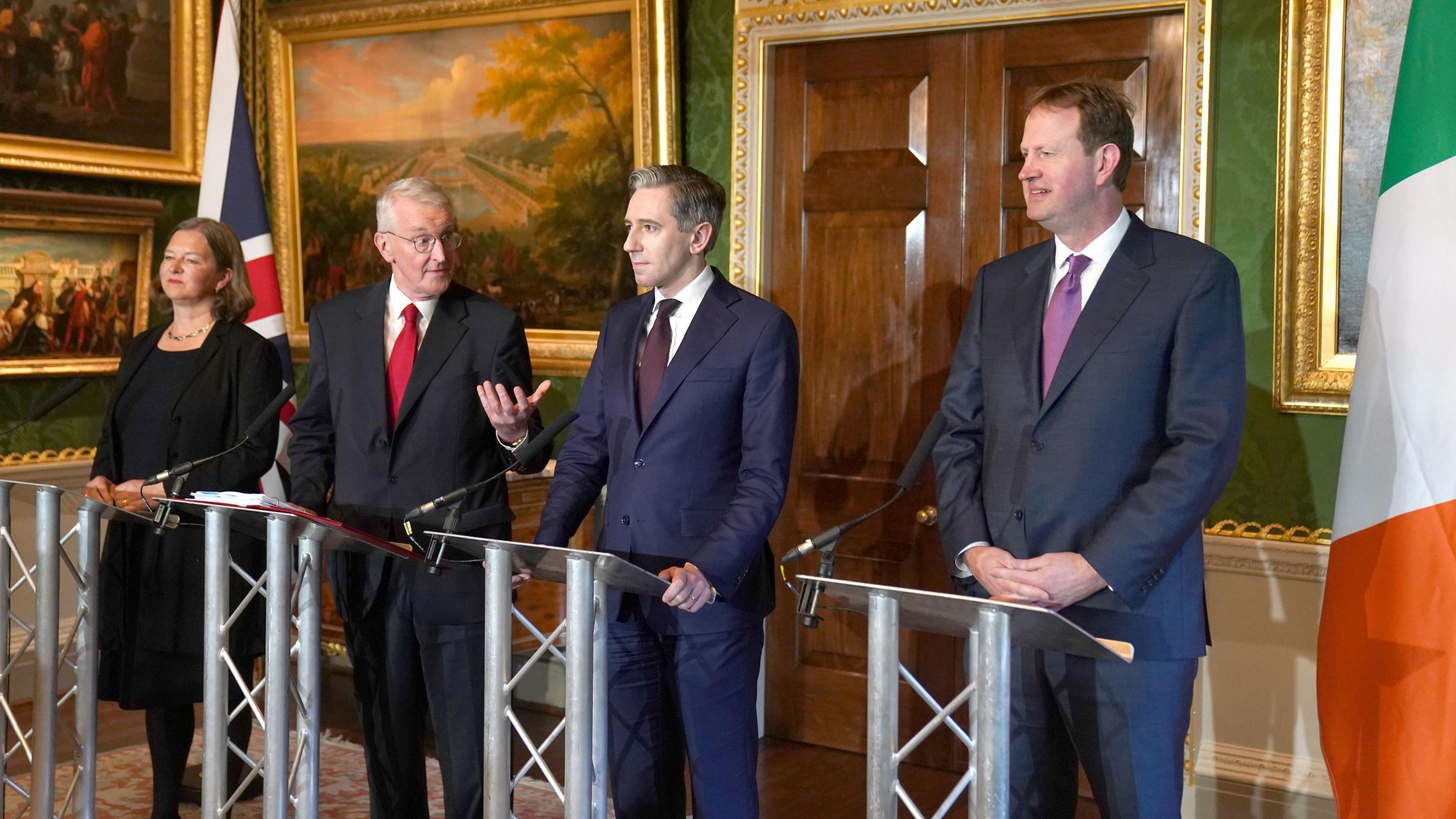 (left to right) Parliamentary under-Secretary of State for Northern Ireland Fleur Anderson, Secretary of State for Northern Ireland Hilary Benn, Tanaiste Simon Harris and Minister for Justice Jim O'Callaghan. They are standing behind podiums.