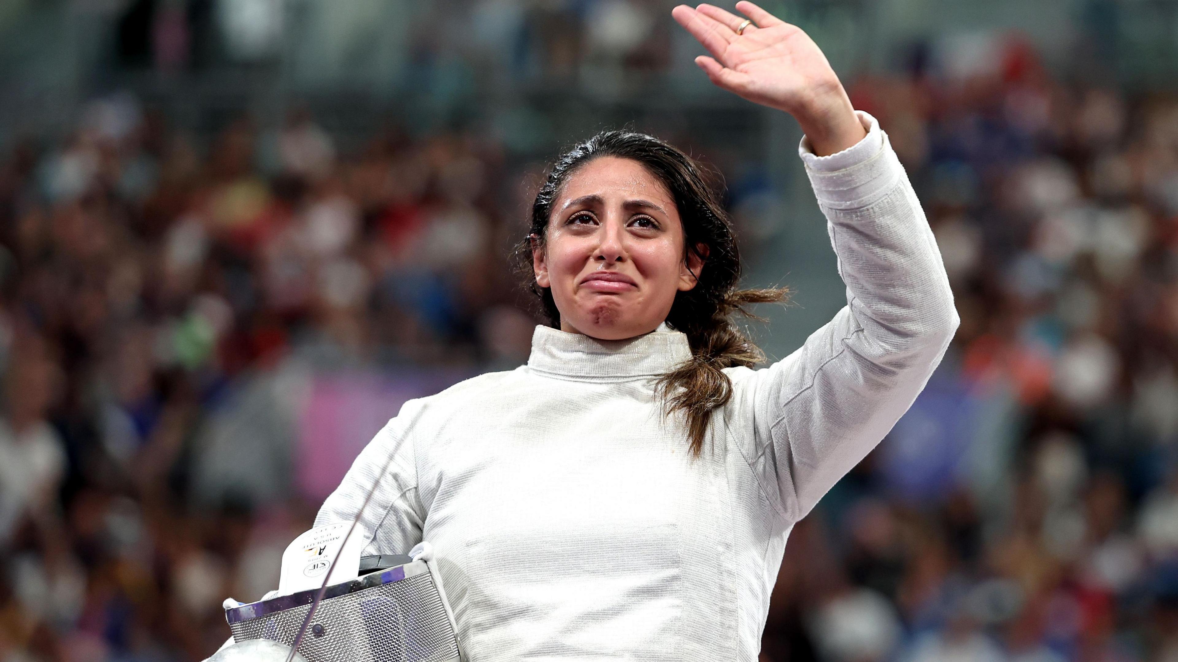 Nada Hafez of Egypt applauds fans after her victory against Elizabeth Tartakovsky at the Paris 2024 Olymics