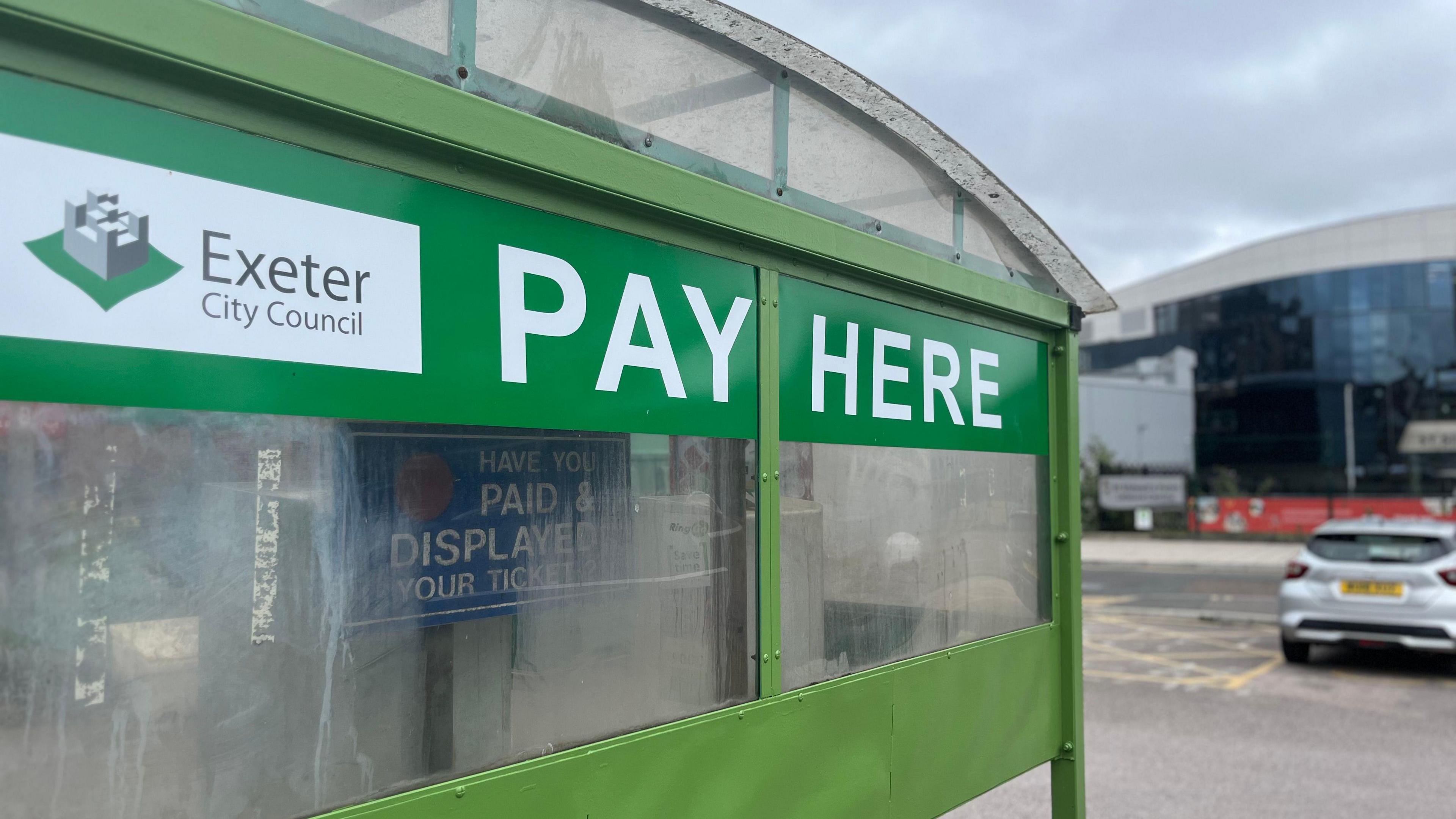 A parking payment sign at Bampfylde Street car park in Exeter