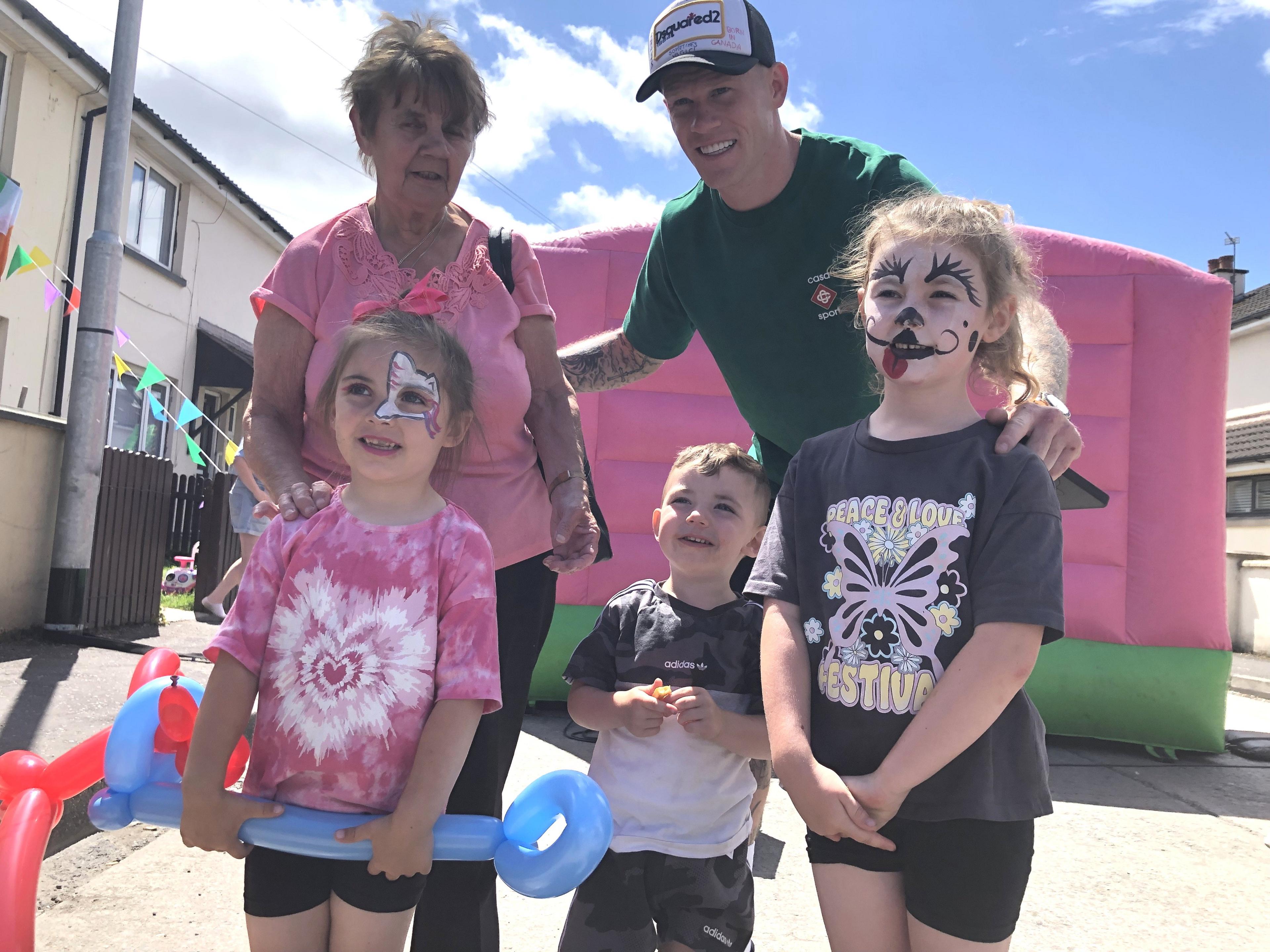 James McClean poses for photos with fans at the Creggan street party