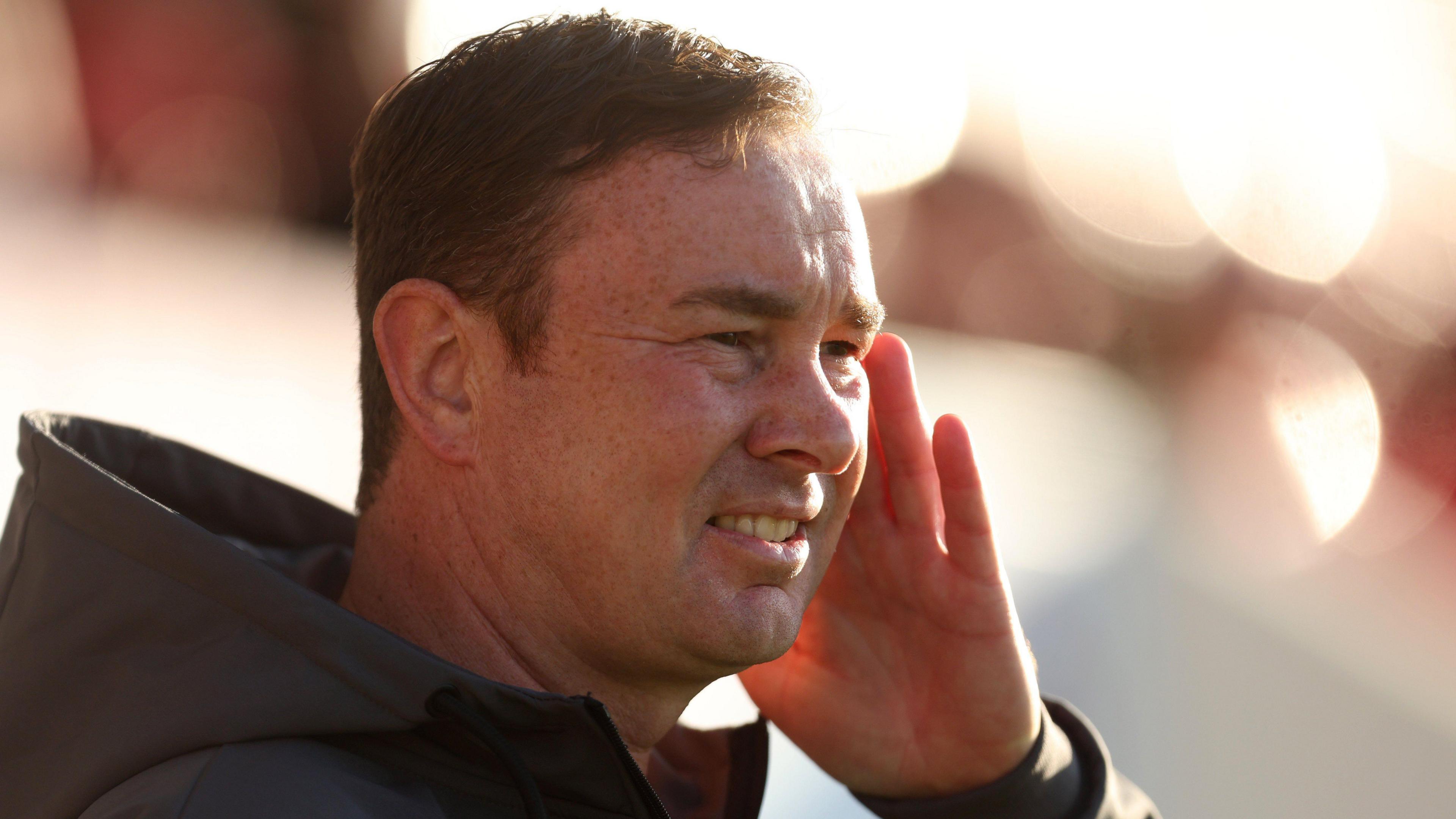 Morecambe manager Derek Adams watches his team