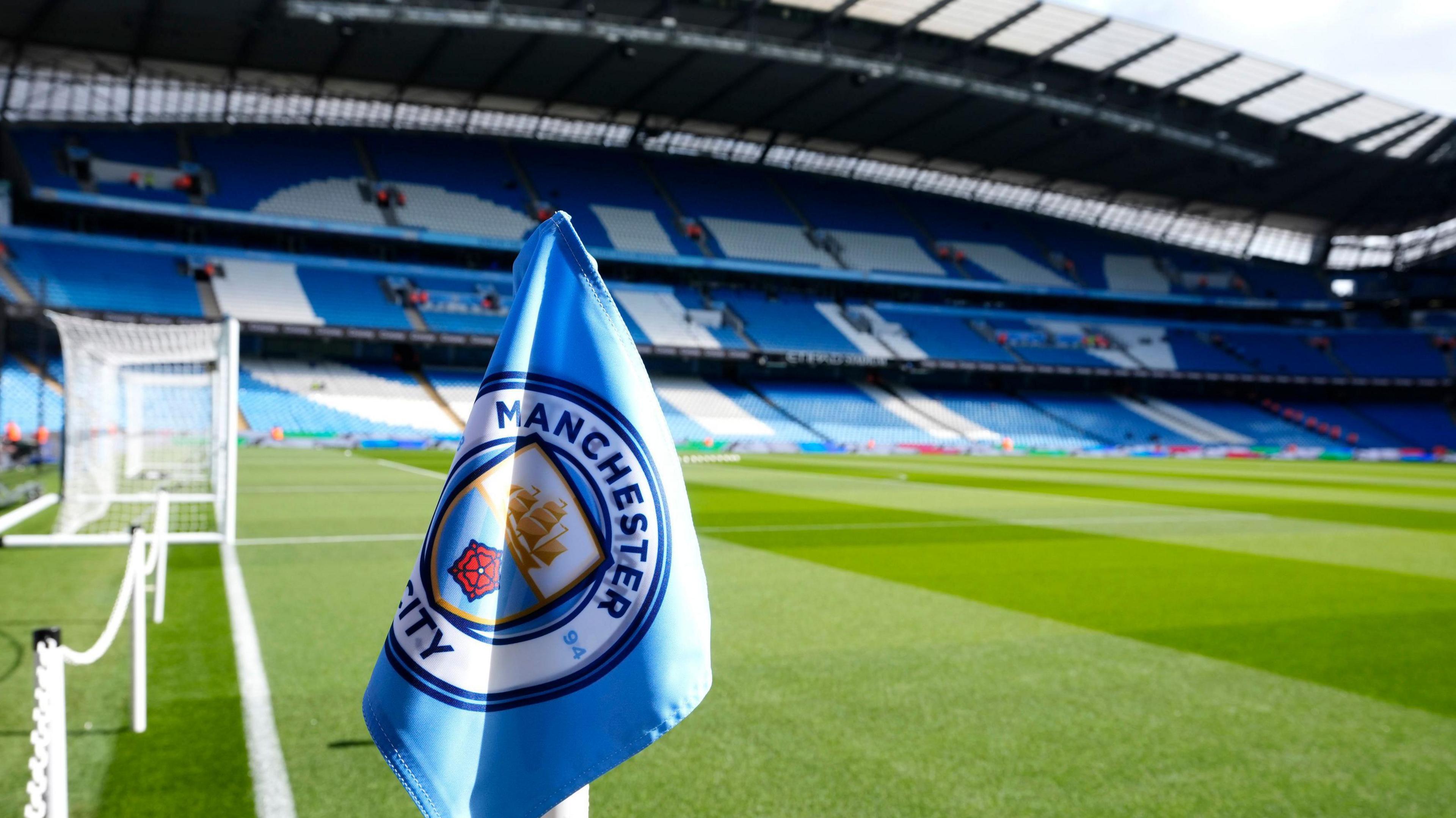 Manchester City corner flag in front of the pitch at the Etihad Stadium in Manchester. 