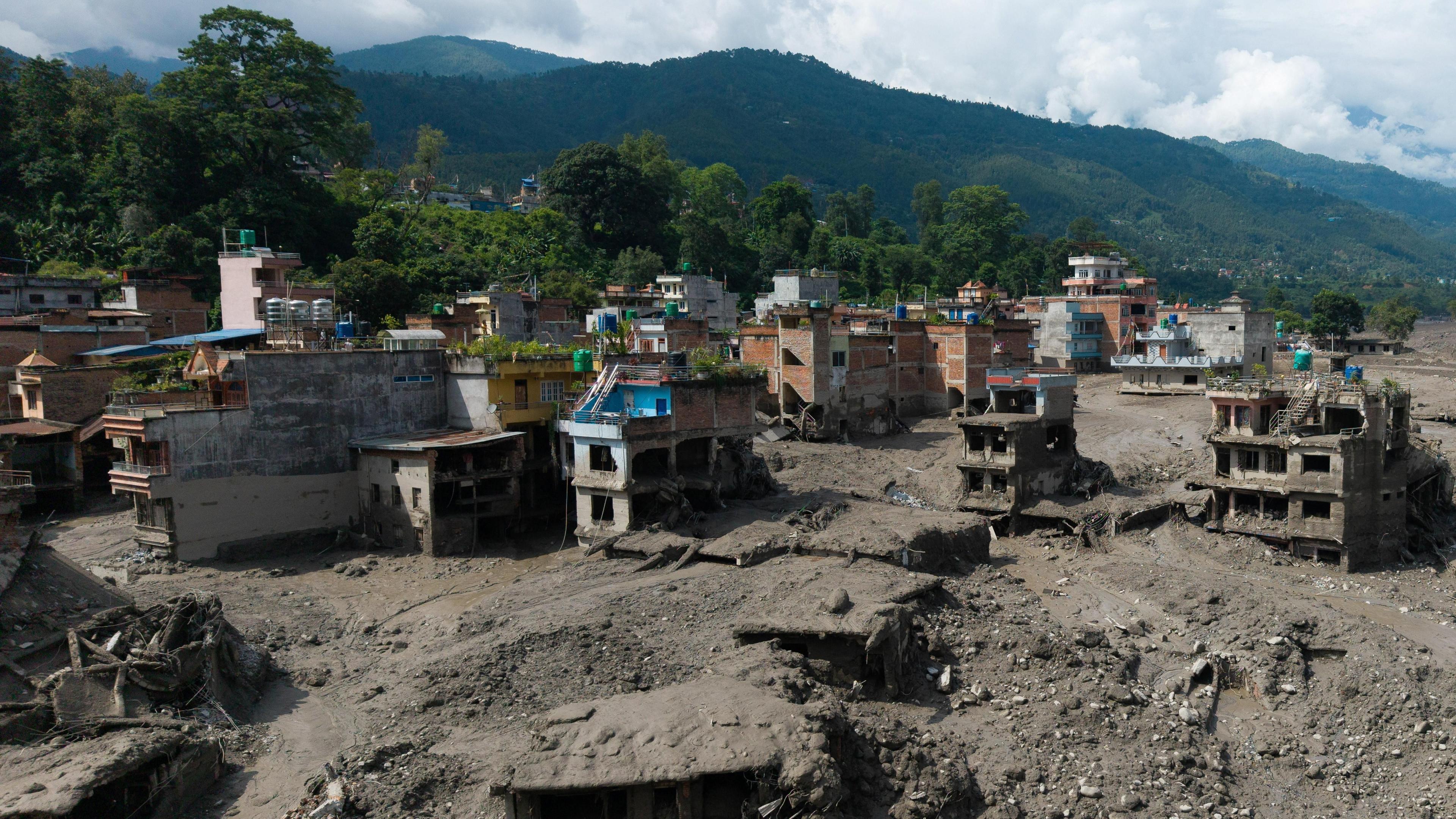 A drone view shows mud covering properties following a flash flood at Trishuli in Nuwakot district, Nepal, August 26, 2026