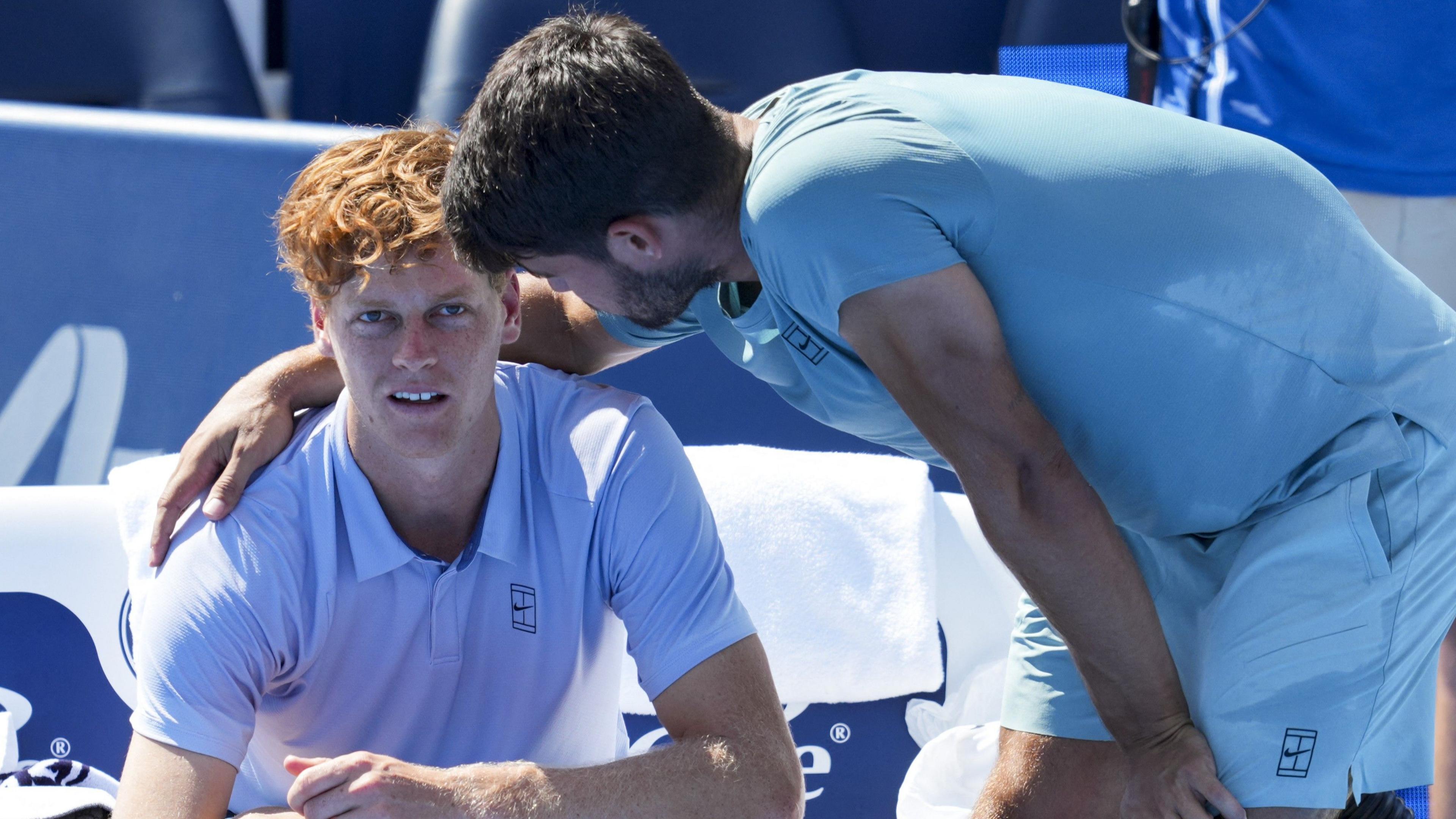 Carlos Alcaraz puts an arm around Jannik Sinner after the Cincinnati Open final