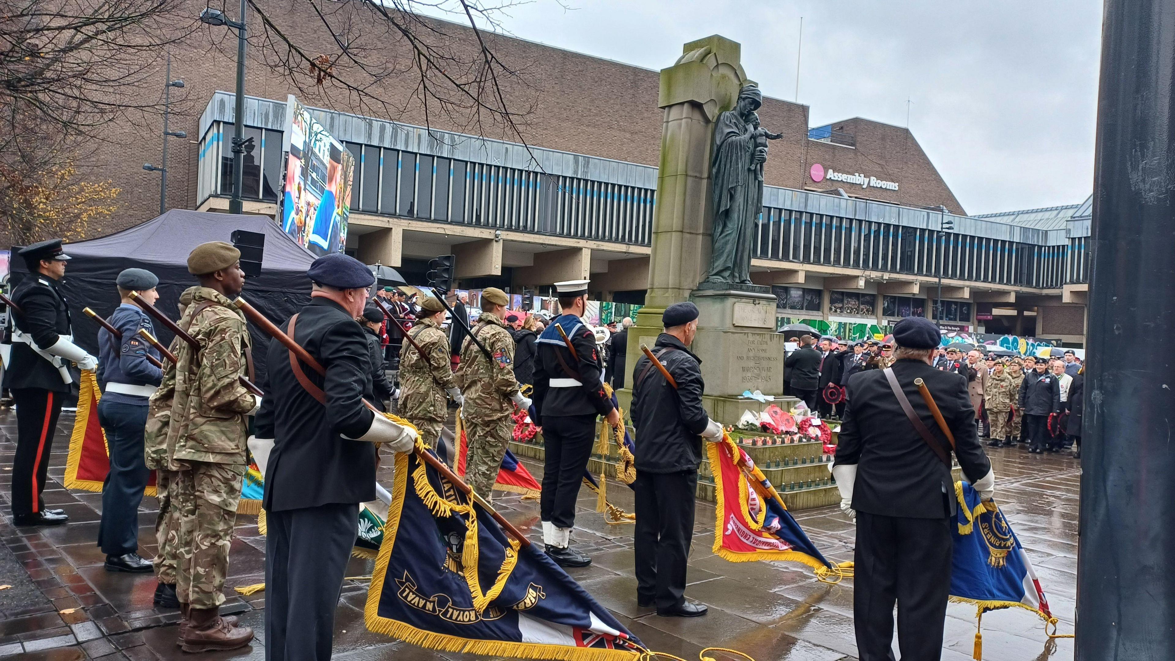 A large group of people gathered at a Remembrance event in Derby