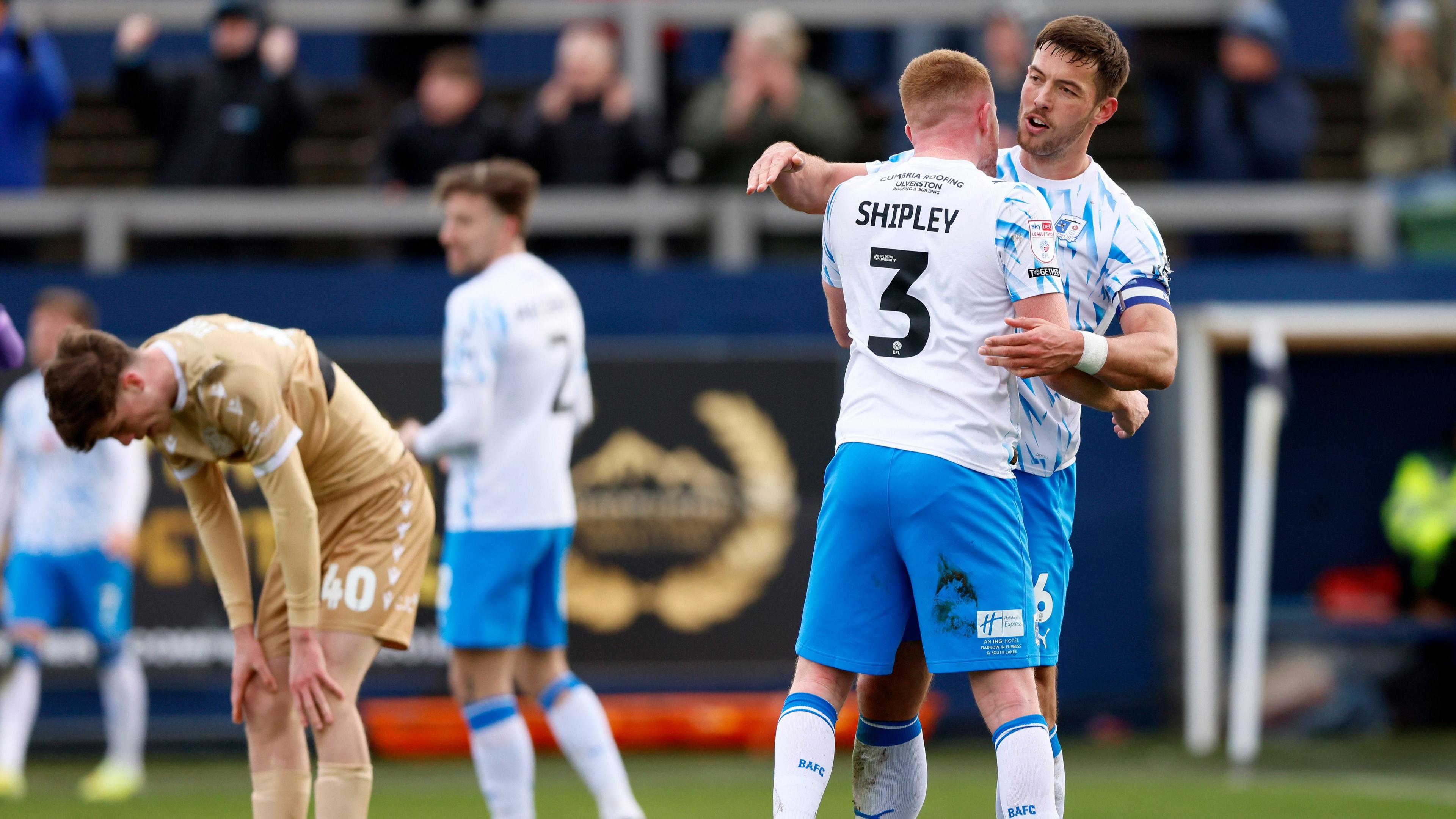Barrow players celebrate beating Bromley 2-1