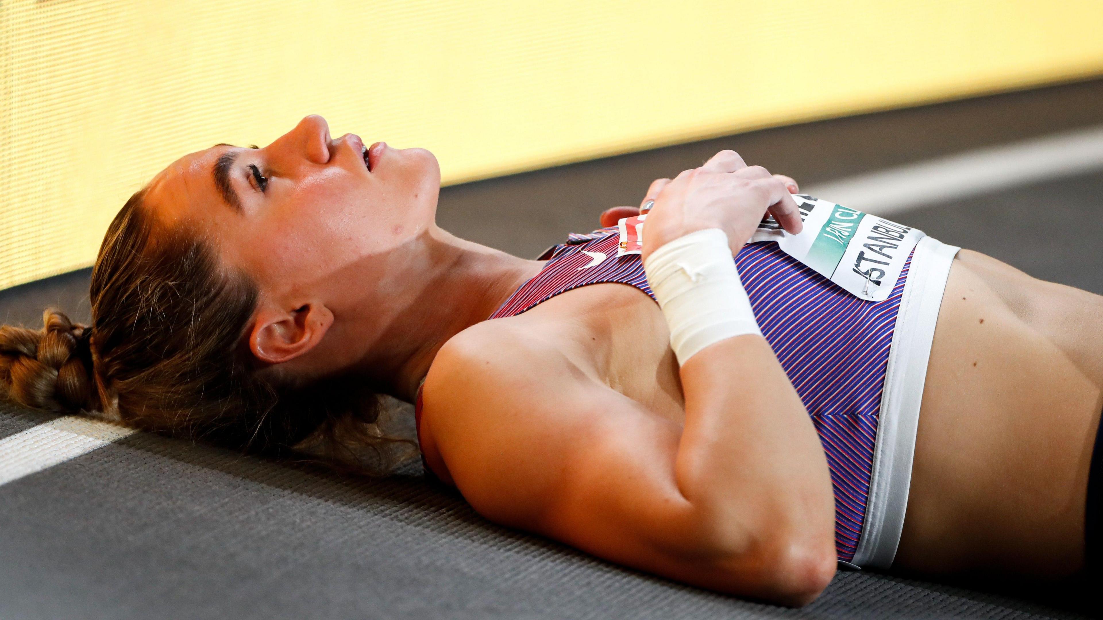 Great Britain Heptathlete Holly Mills lies on the outside of the track at the European Indoor Athletics in Istanbul, Turkey in 2023