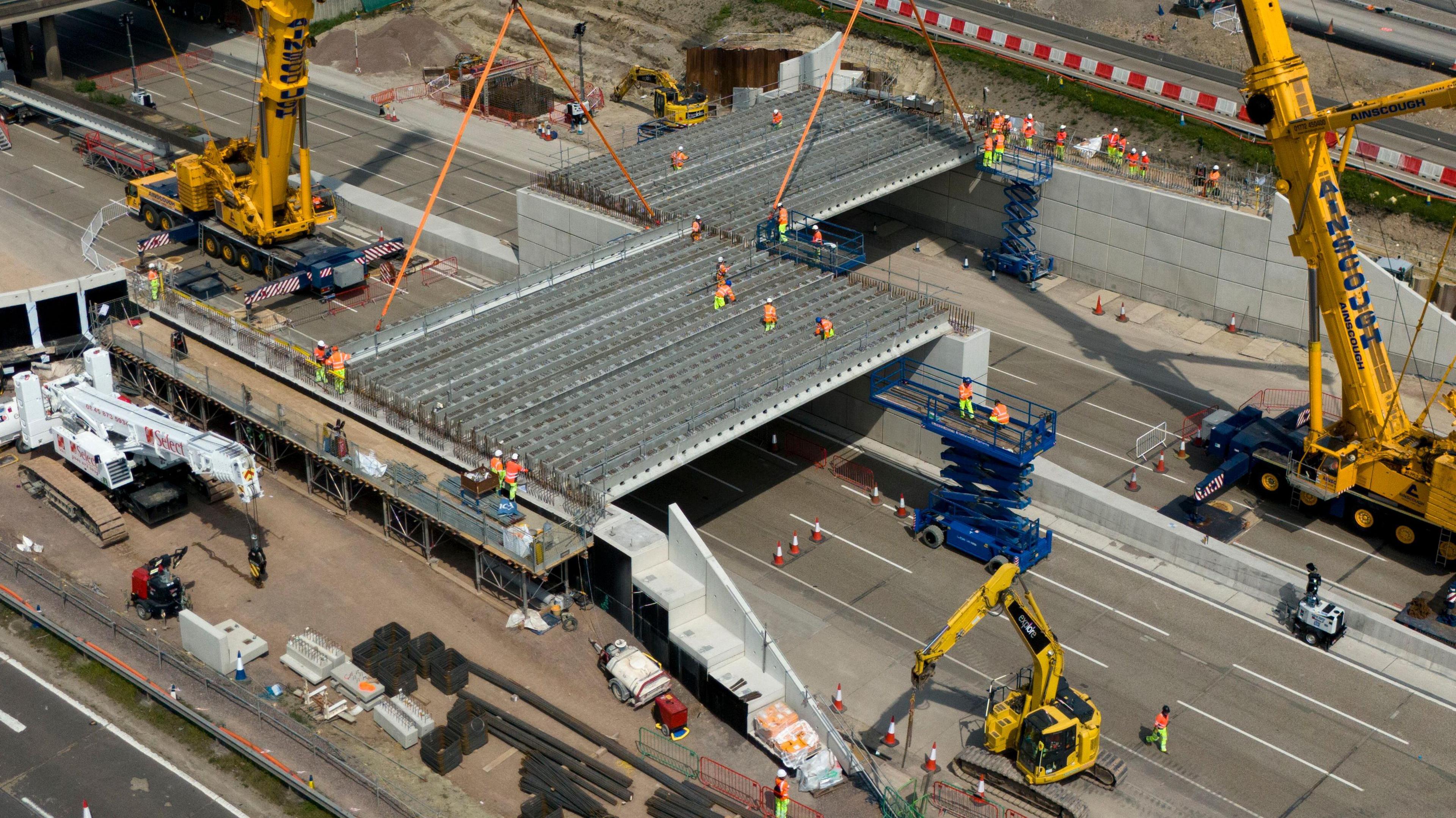 Engineering works taking place at the A3 Wisley interchange at Junction 10 of the M25 as concrete beams for a new bridge are installed