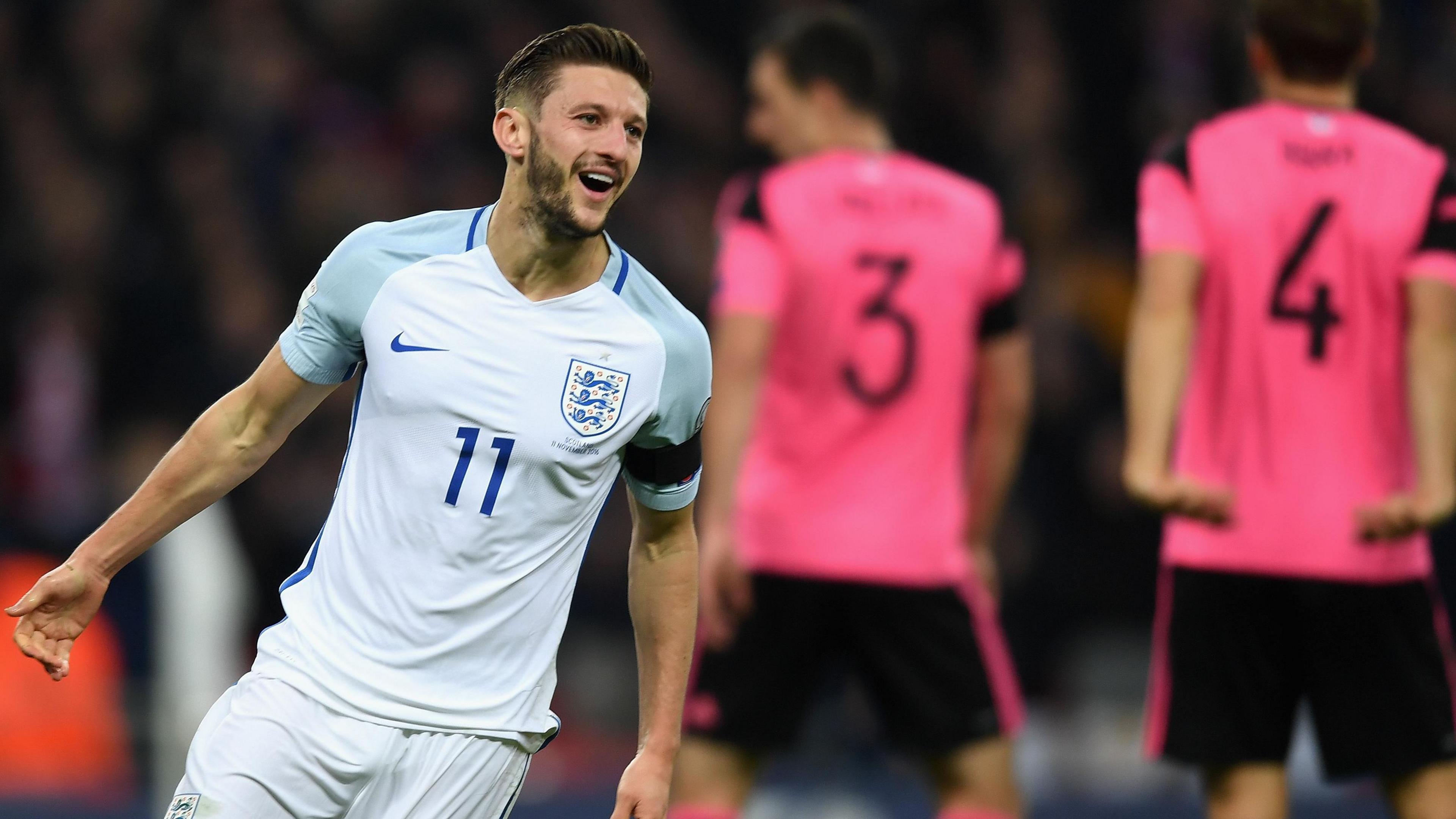 Adam Lallana celebrates scoring for England