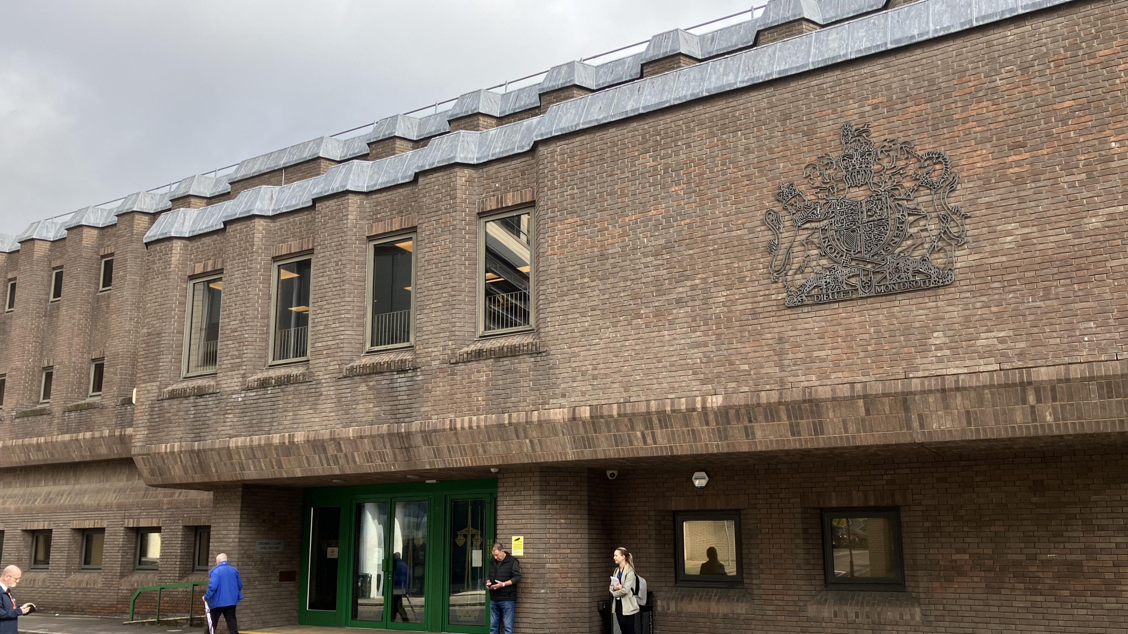 Exterior of Chelmsford Crown Court showing a dull brown block building with uniform windows