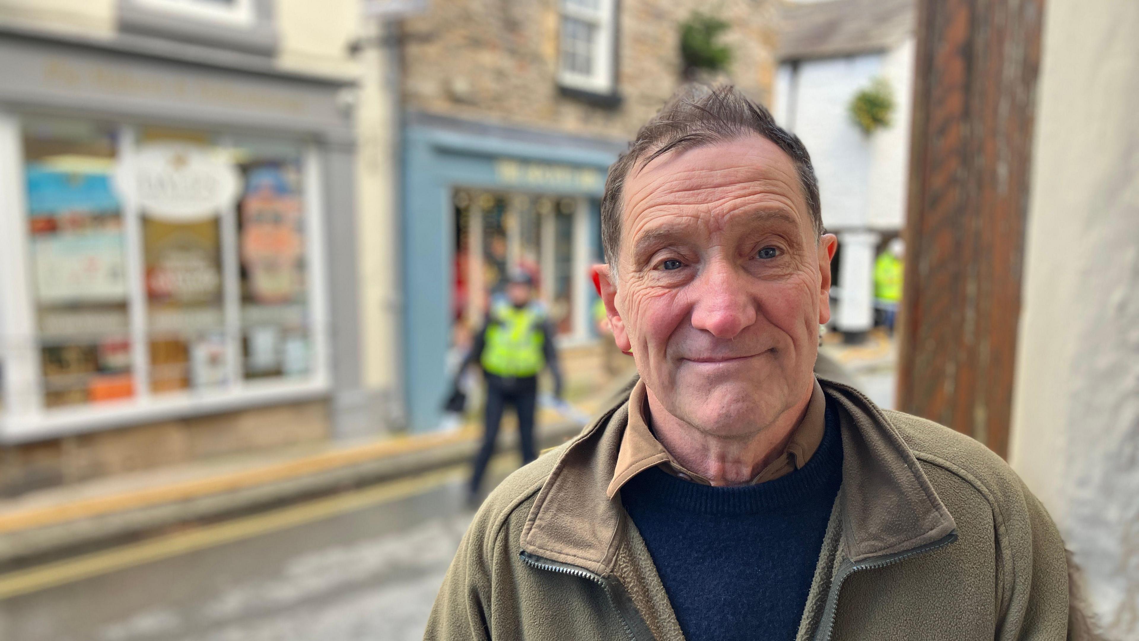 Landlord and building owner John Short, standing outside the Save the Children charity shop on Market Street, Kirkby Lonsdale