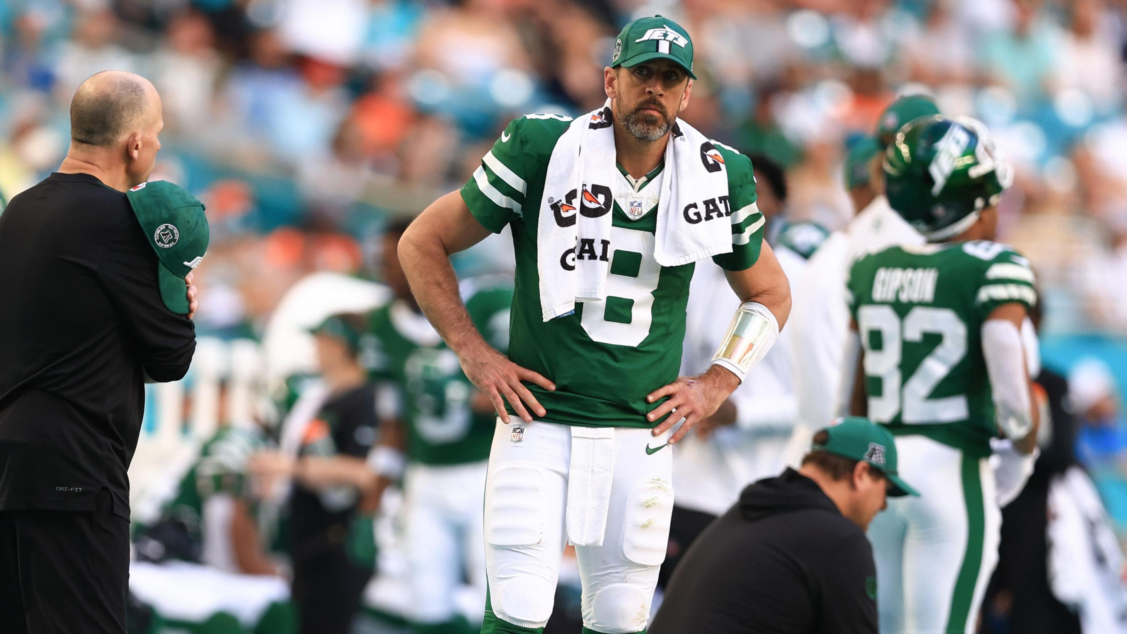 Aaron Rodgers of the New York Jets looks on with hands on hips after another defeat