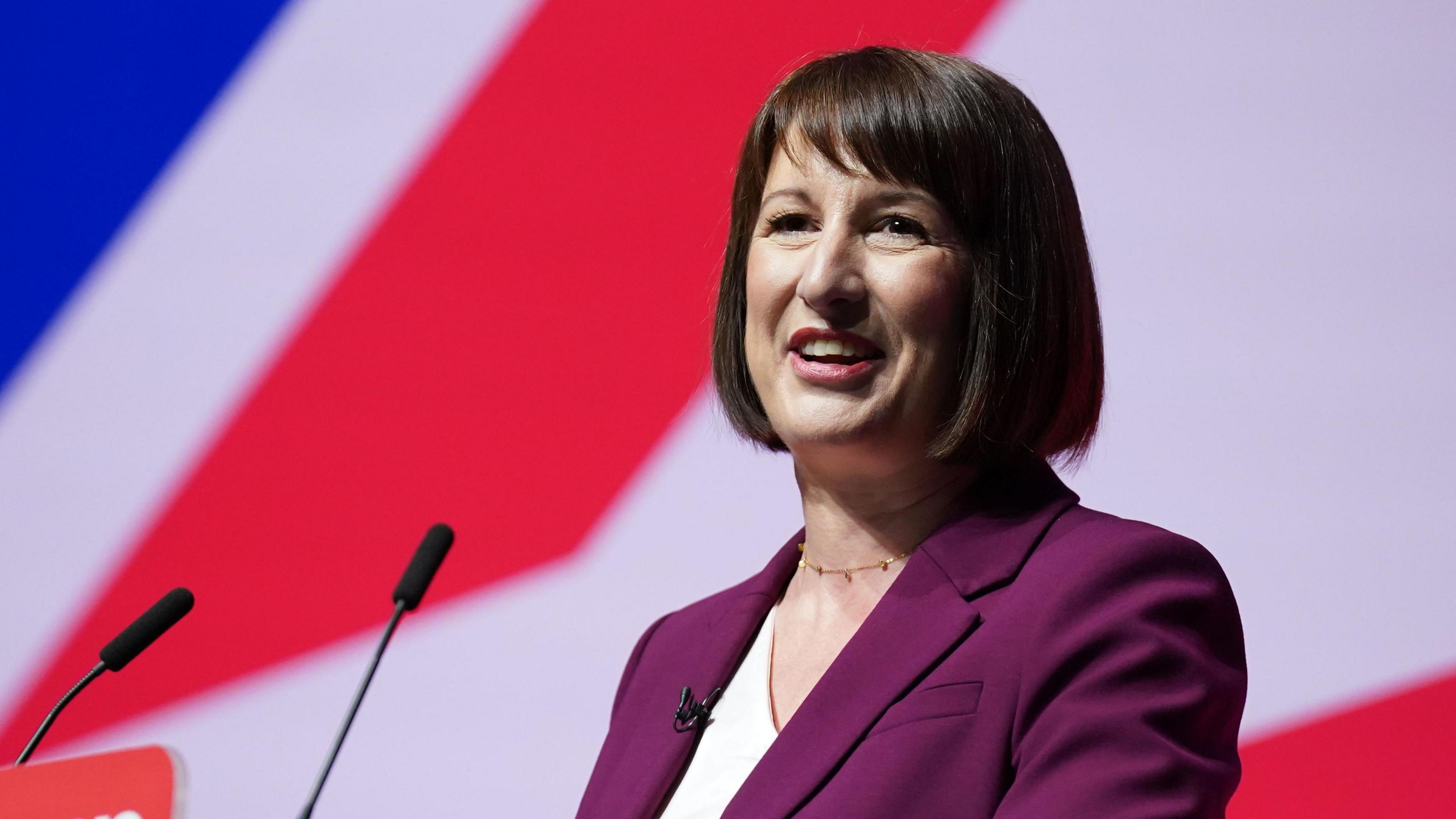 Budget 2024: Chancellor Rachel Reeves stands at a lectern in front of a British flag