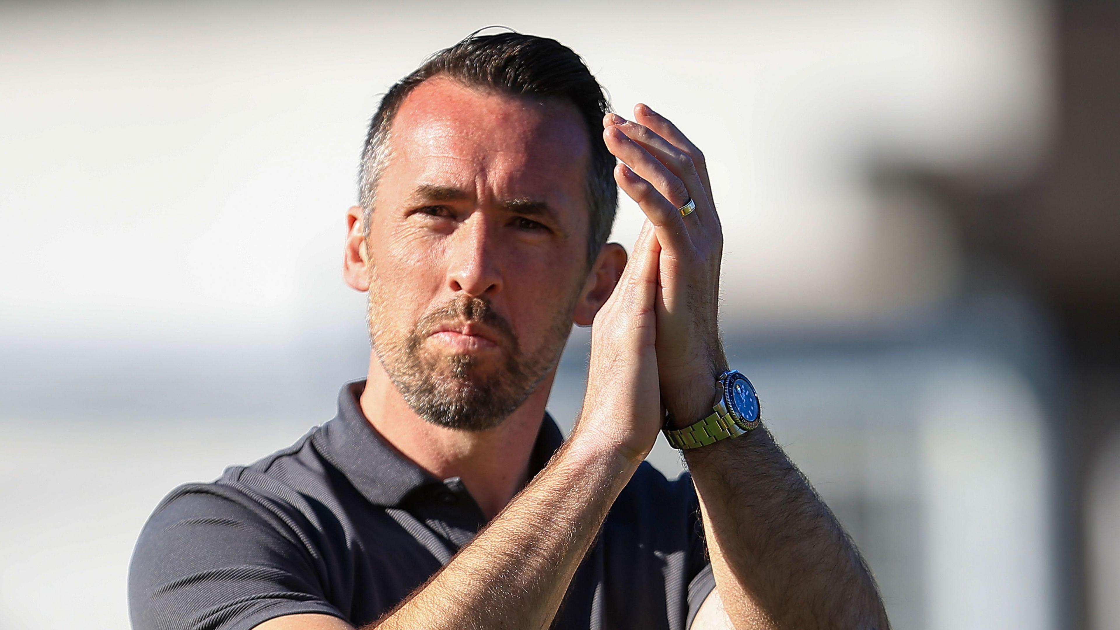 Newport County boss Christian Fuchs applauds