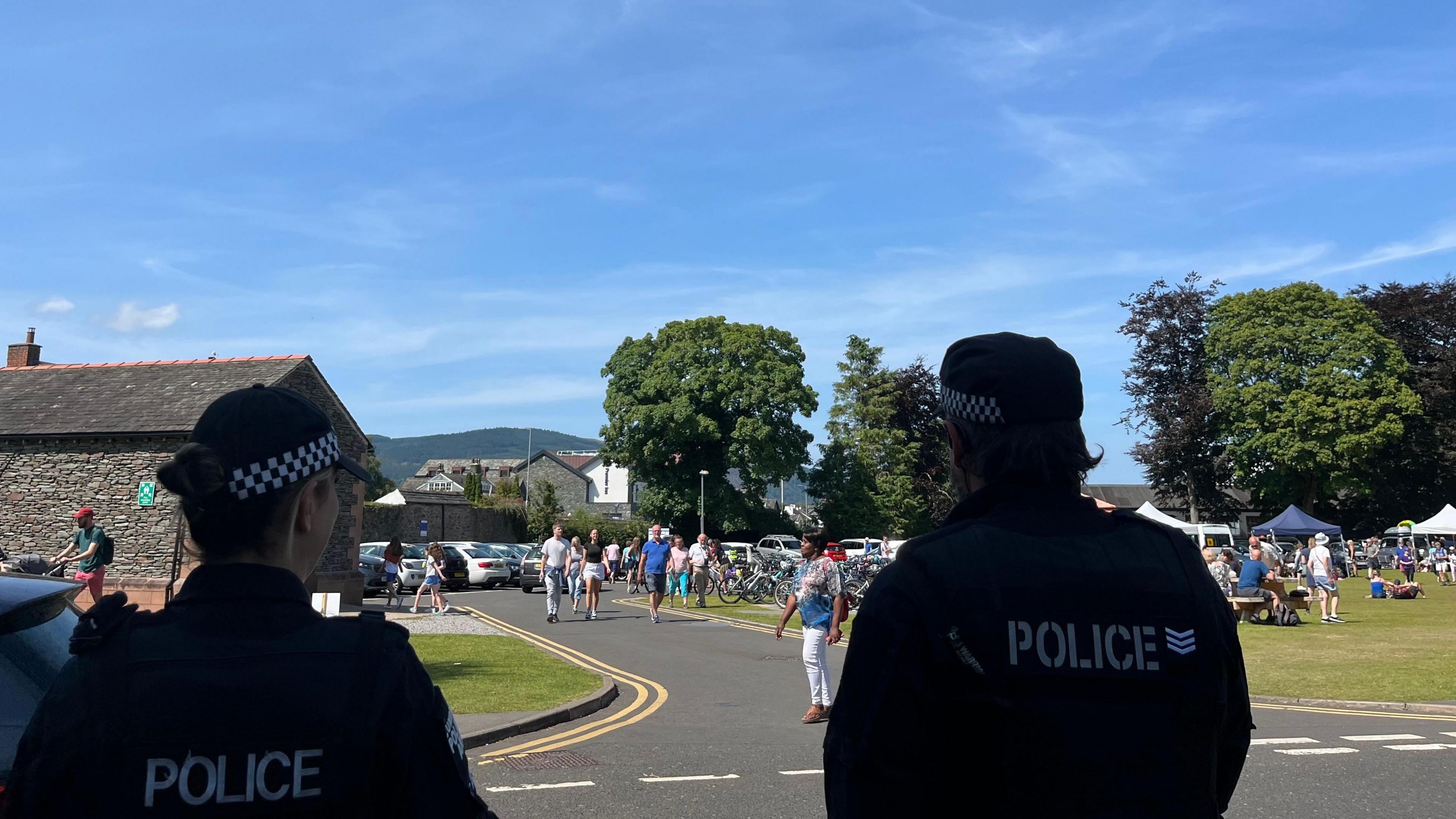 Armed police watch over the crowds at the Keswick Convention.