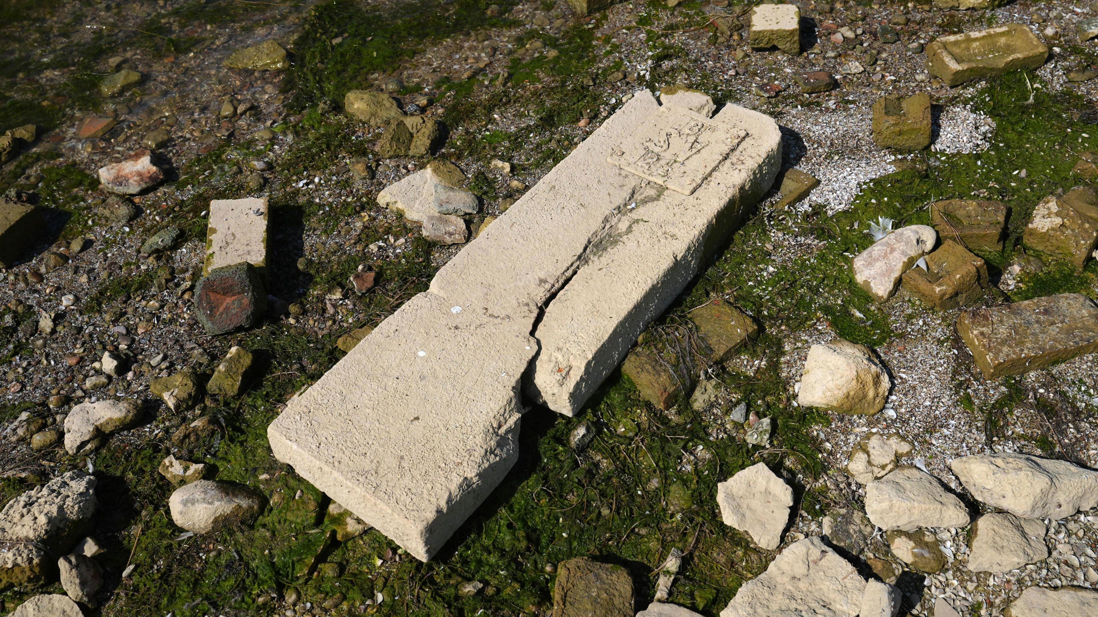 Stonework from the lost village of Nether Hambleton is revealed by the low water levels at Rutland Water reservoir in the East Midlands. 