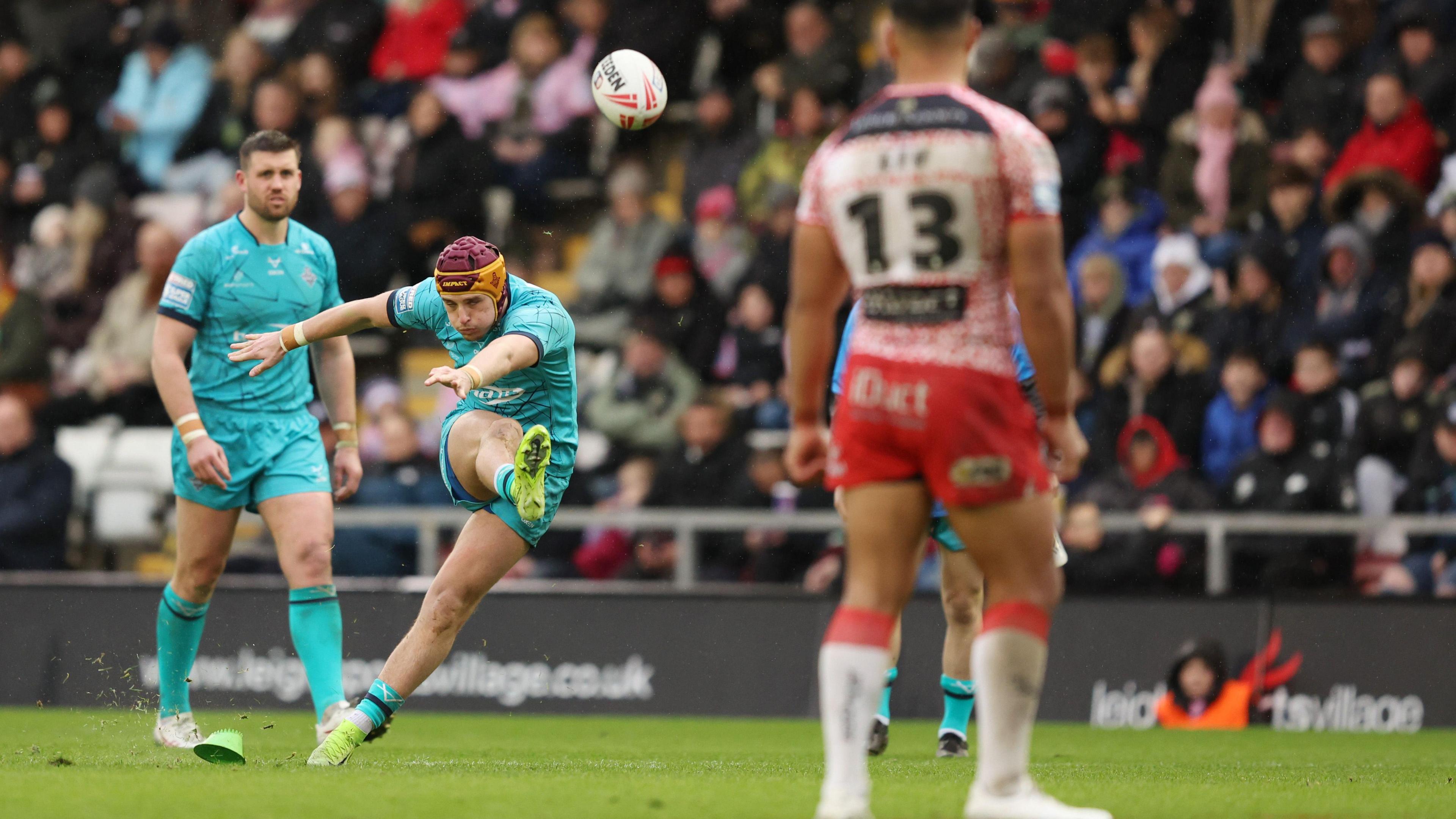 George Flanagan kicking at goal for Huddersfield