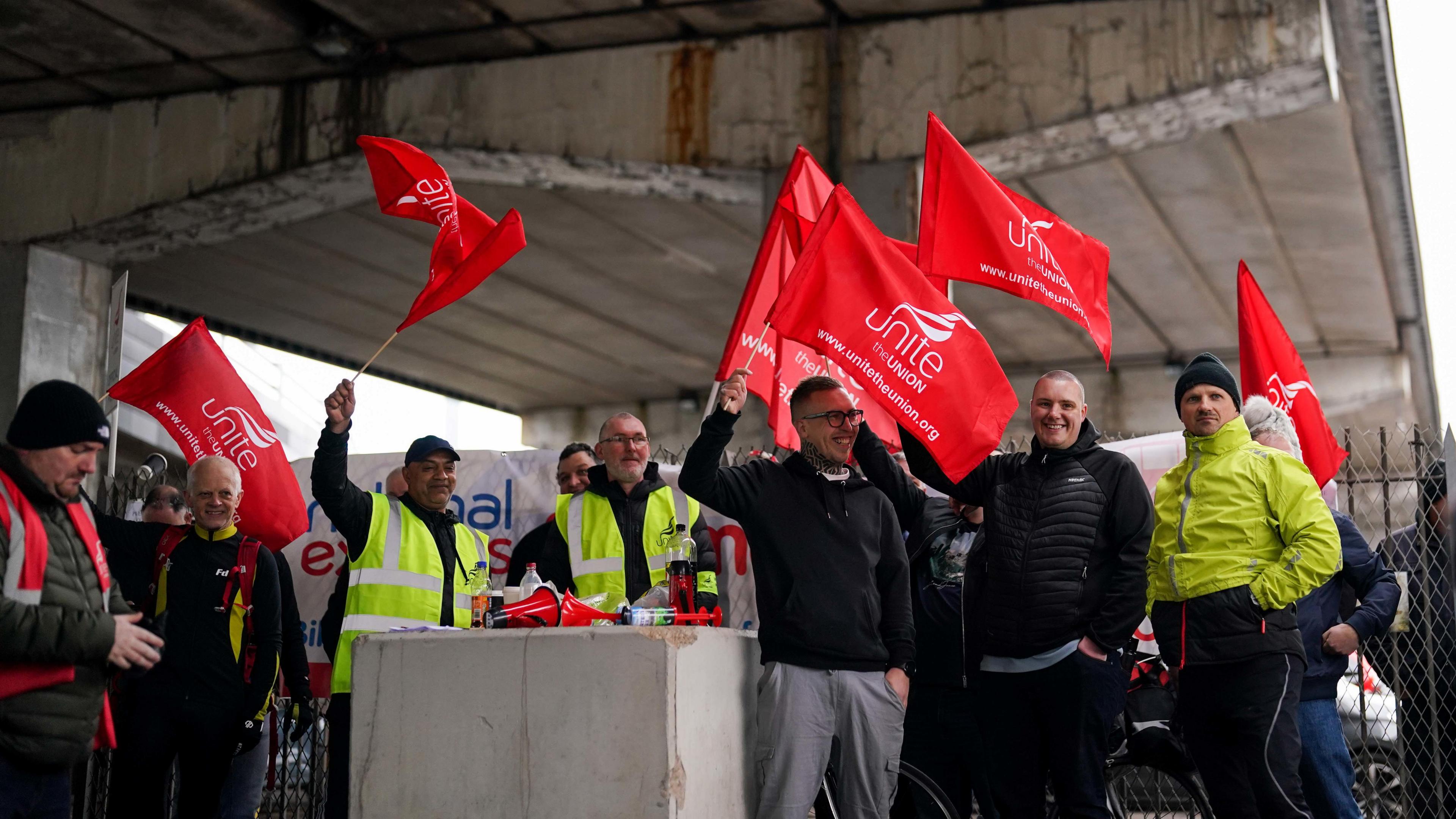 Bus drivers from the Unite union on the picket line outside the National Express West Midlands bus garage in Coventry,